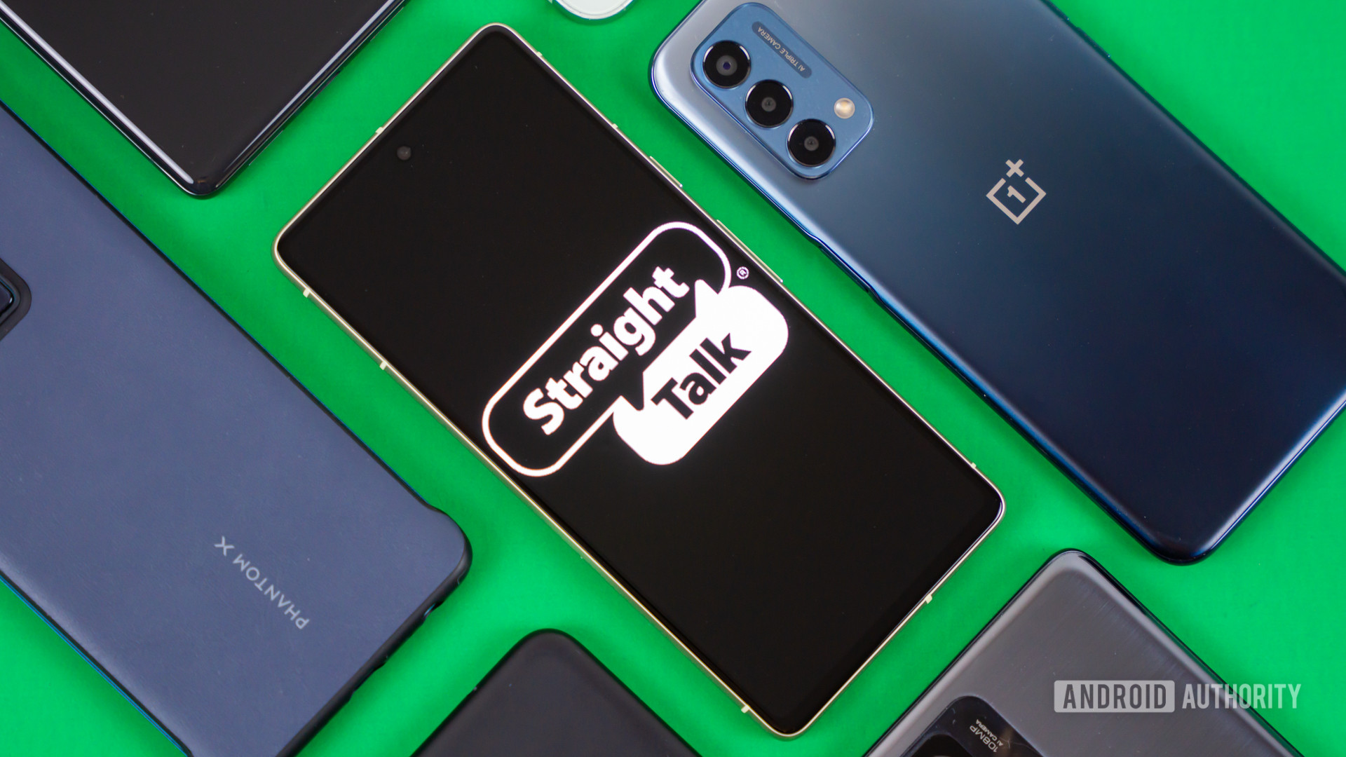 Stock photo of Straight Talk logo on phone with many devices 4