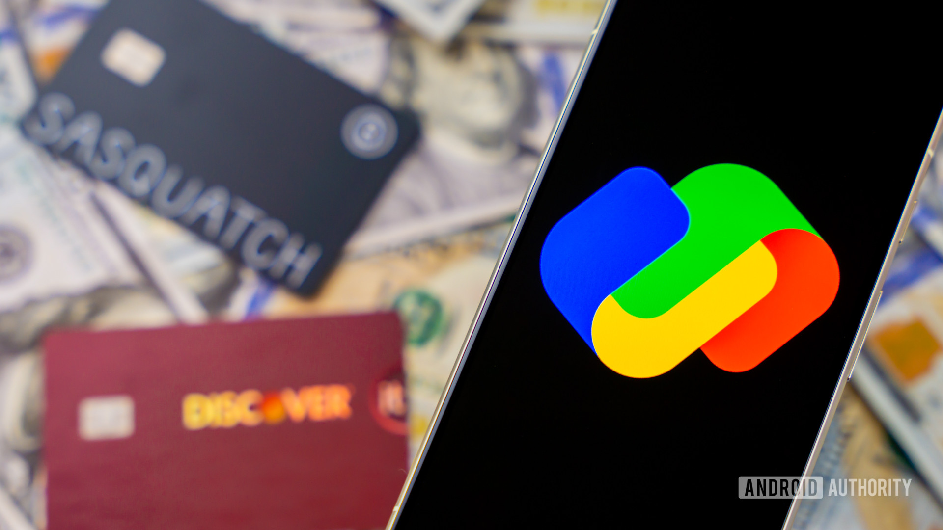 Google Pay logo on smartphone next to money and cards Stock photo 2