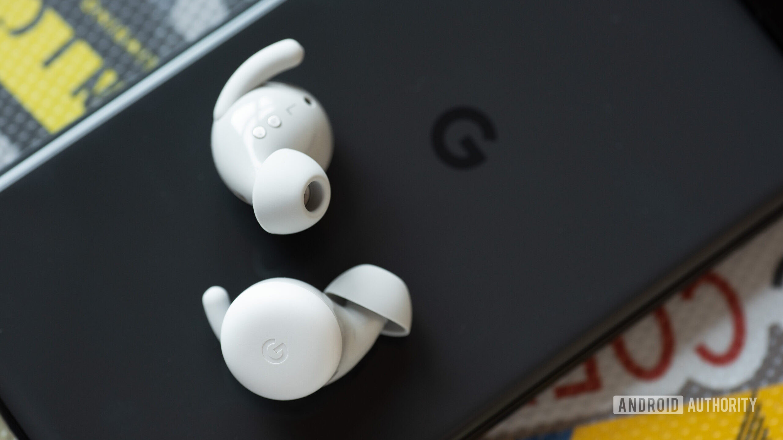 The Google Pixel Buds A-Series earbuds on a Pixel 6 phone.