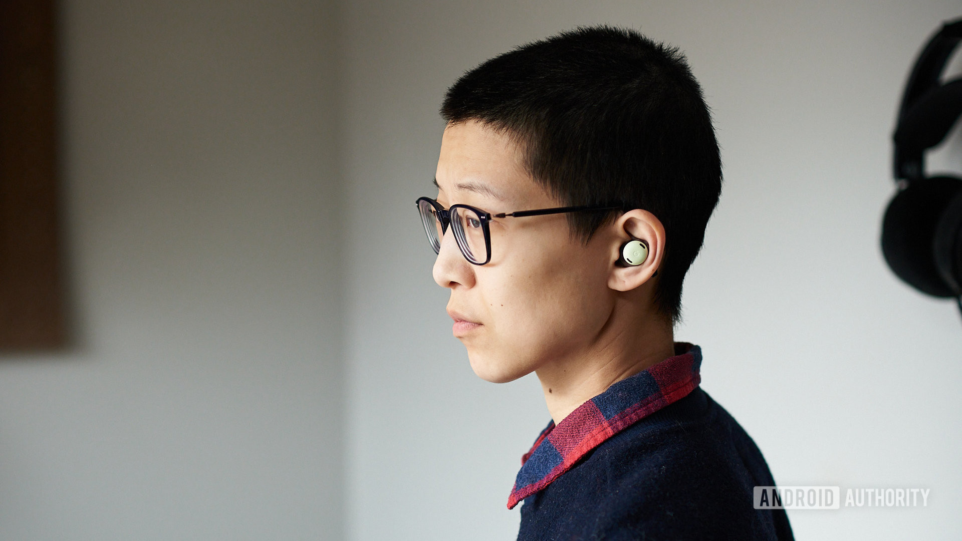 A person wears the Google Pixel Buds Pro.
