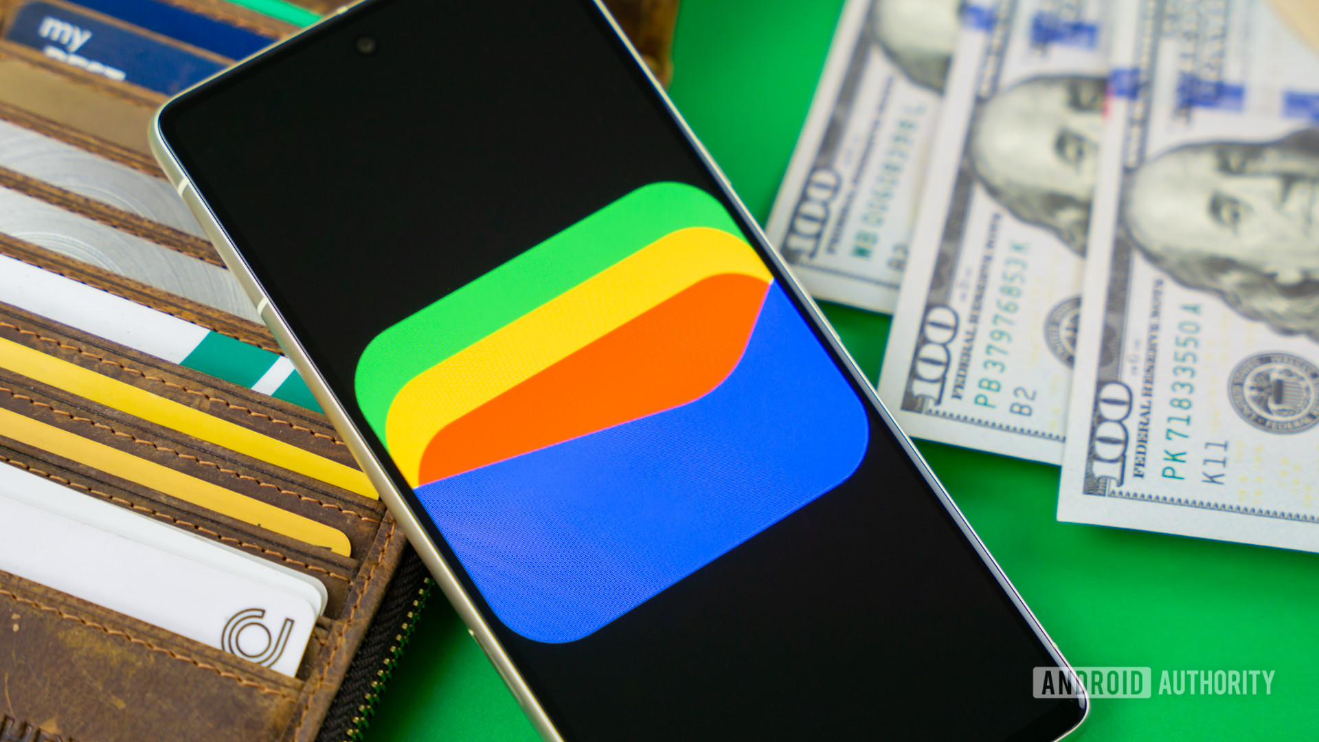 Google Wallet logo on smartphone next to credit cards and cash Stock photo 11