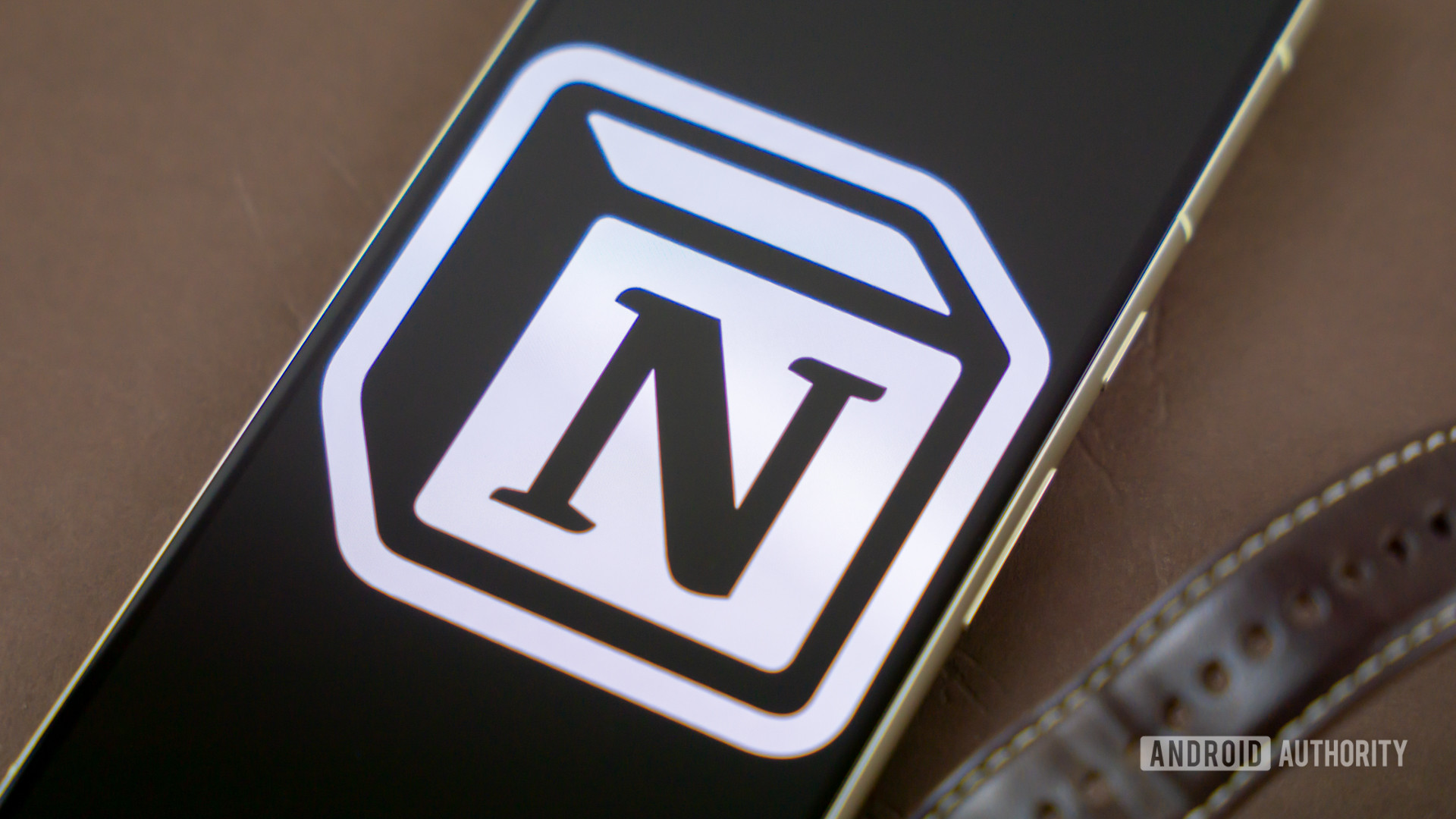 Notion logo on snartphone next to other office products Stock photo 5