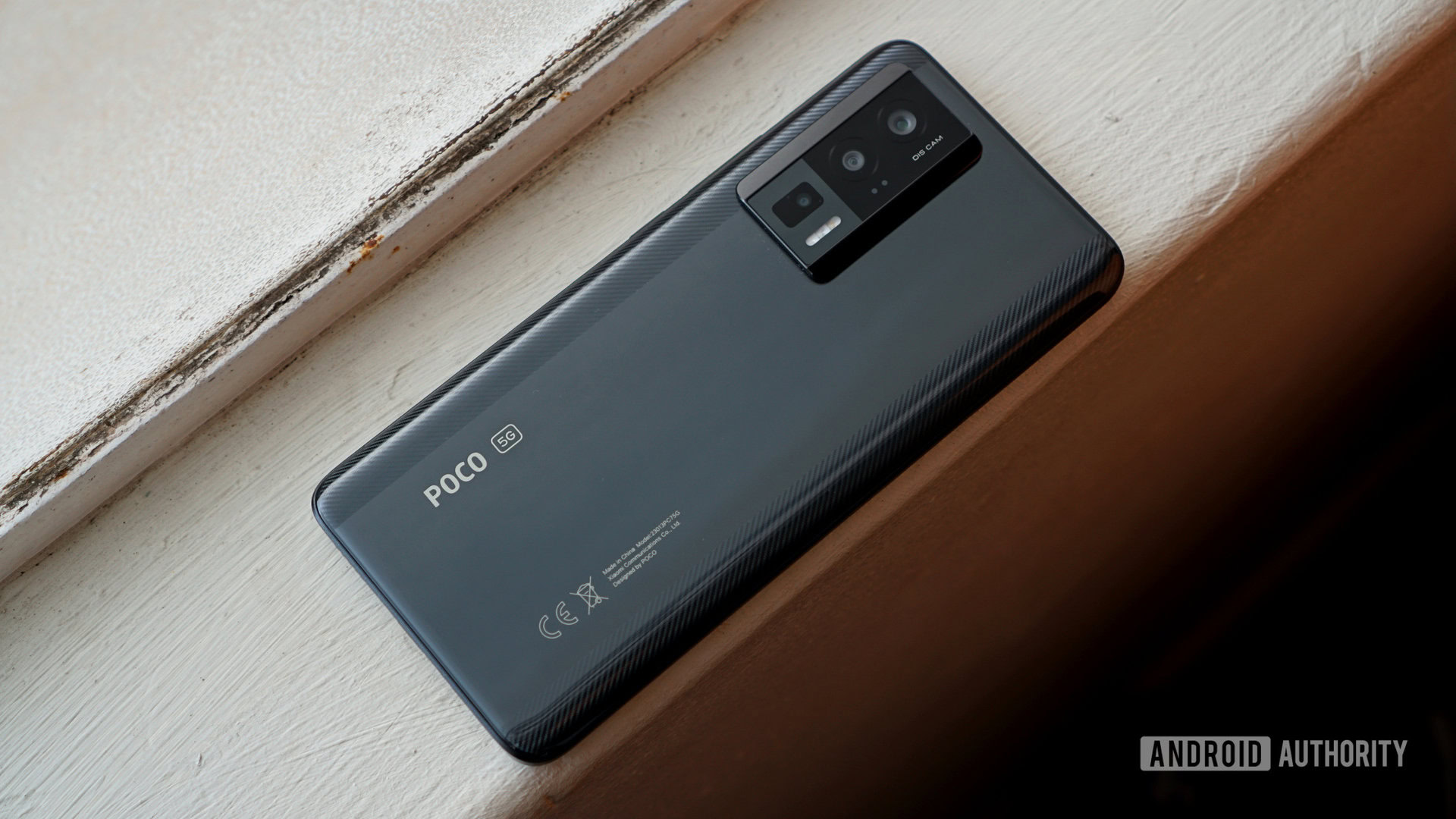 Poco F5 Pro face down on window sill