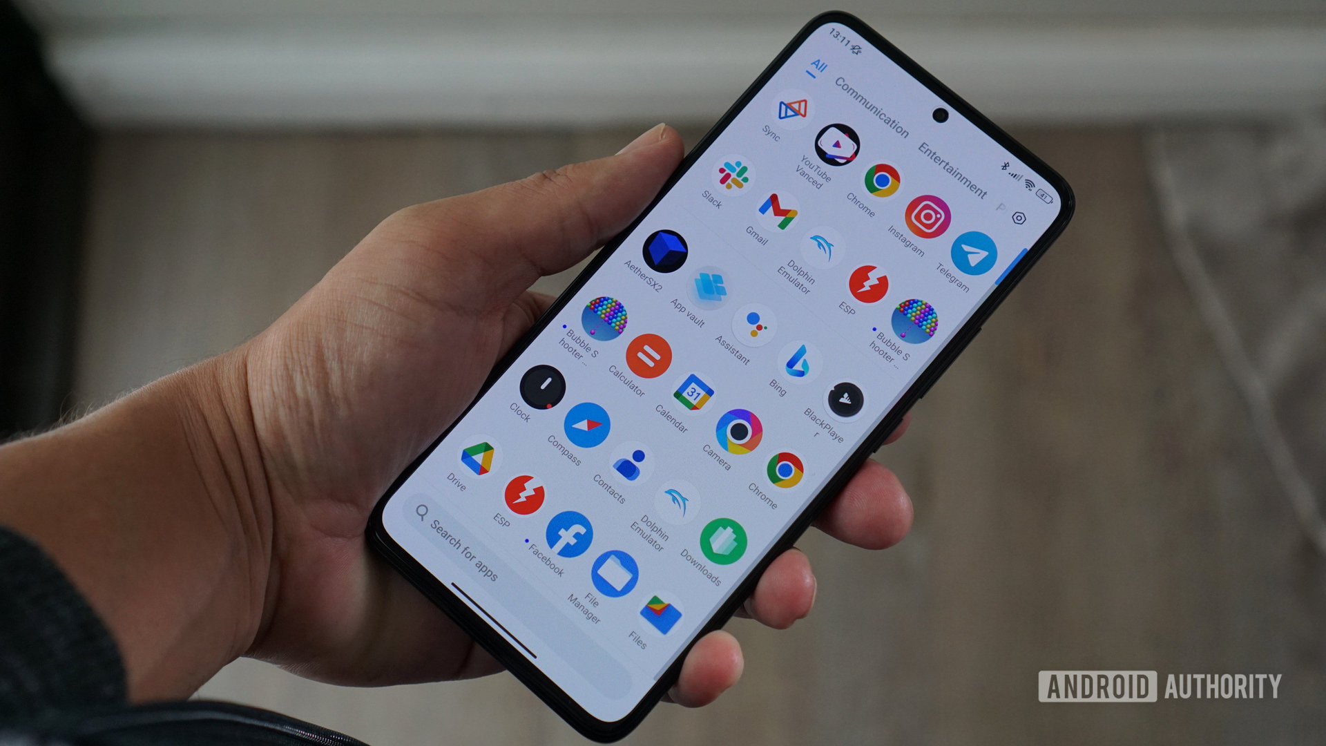 Poco F5 Pro in hand looking at screen