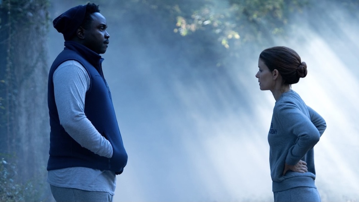 Kate Mara and Brian Tyree Henry stand facing each other in a forest in Class of '09 - best new streaming shows