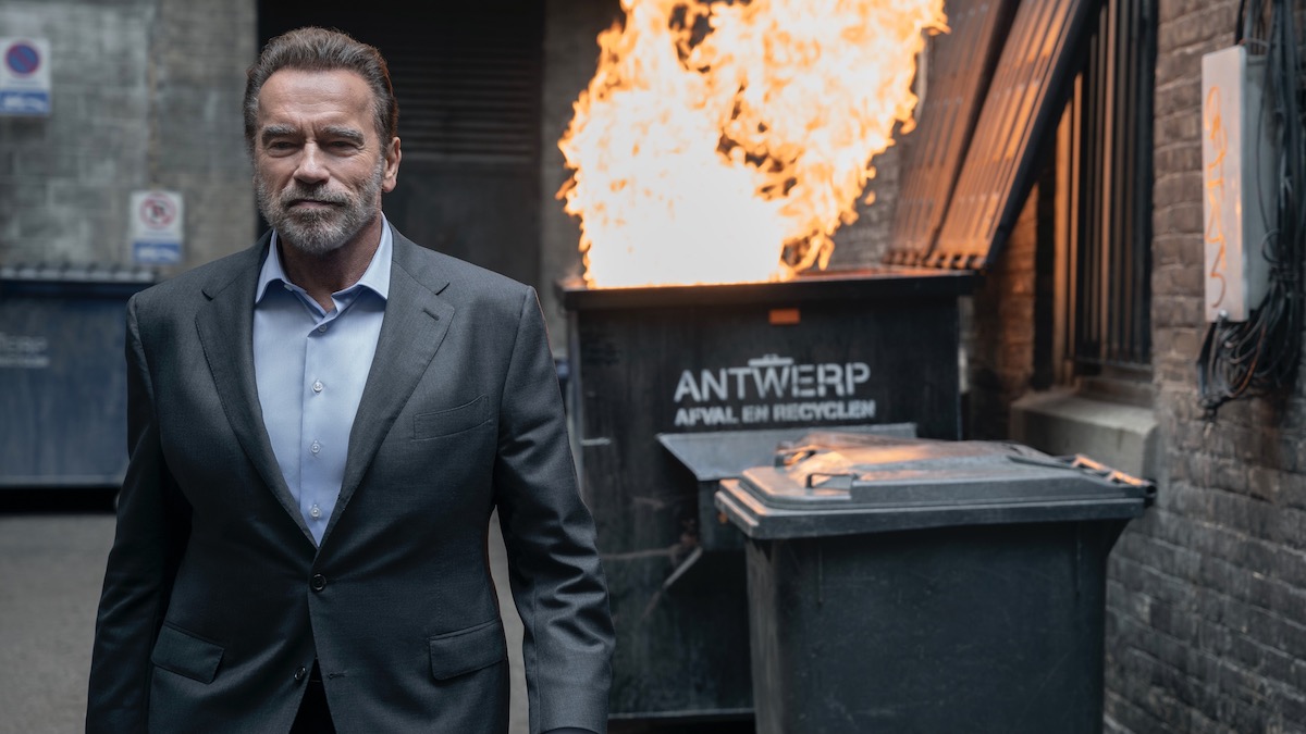 Arnold Schwarzenegger walks away from a burning dumpster in FUBAR