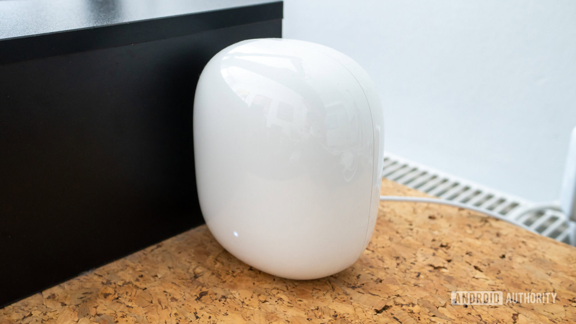 Google Nest Wi Fi Pro node angle view on cork desk