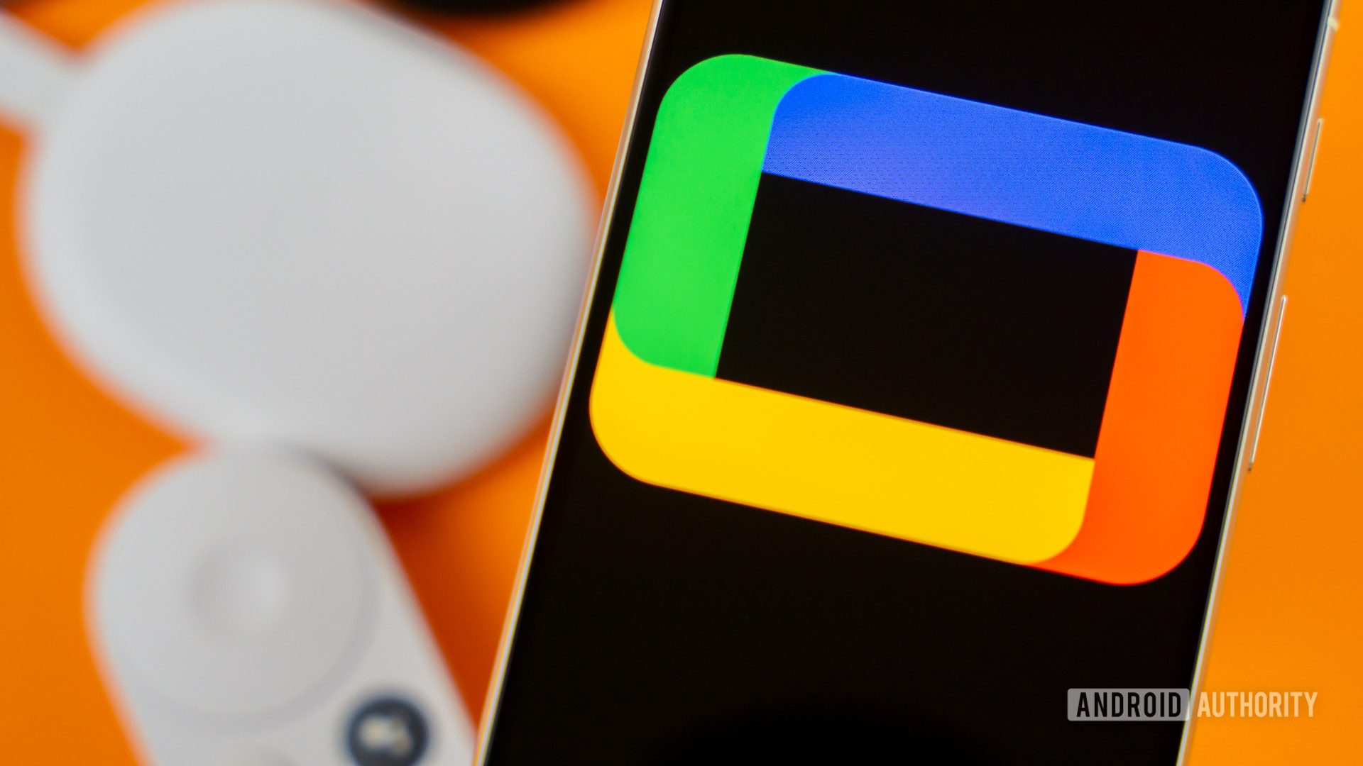 Google TV logo on smartphone next to Chromecast devices and remote Stock photo 2