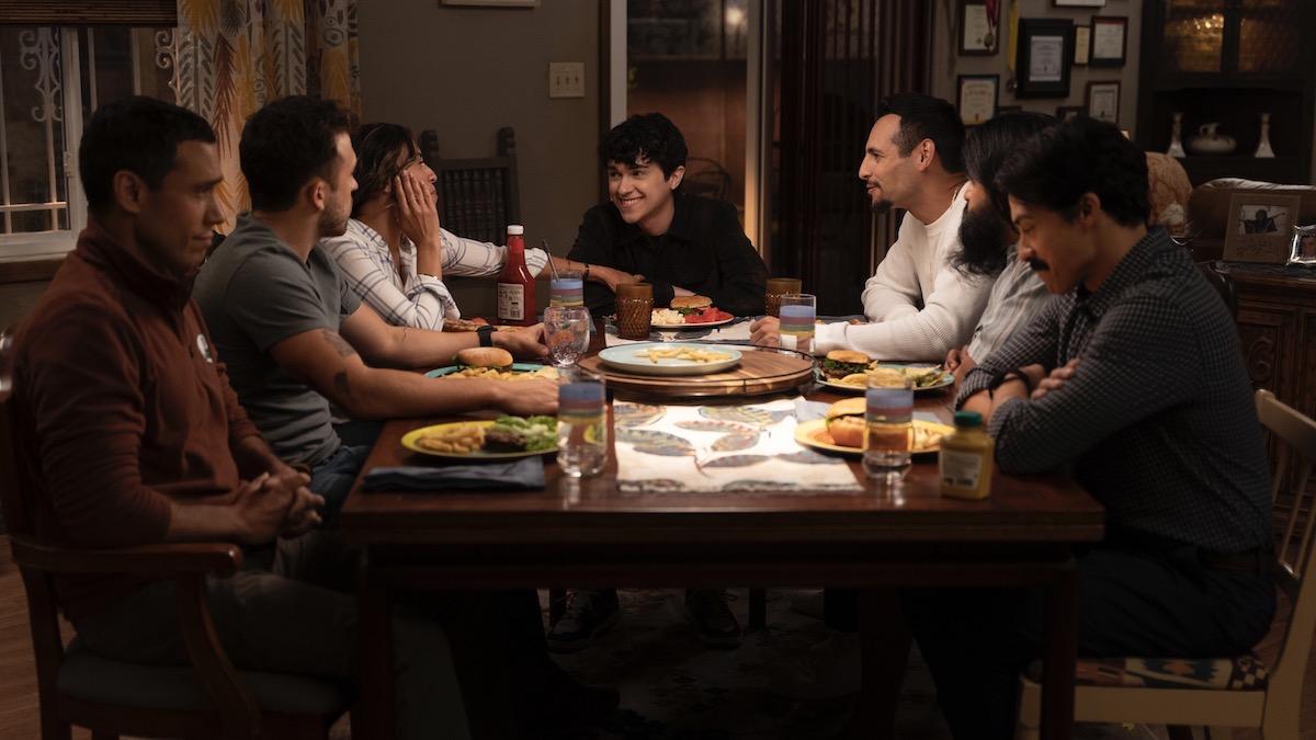 a family sits at a dinner table in Primo