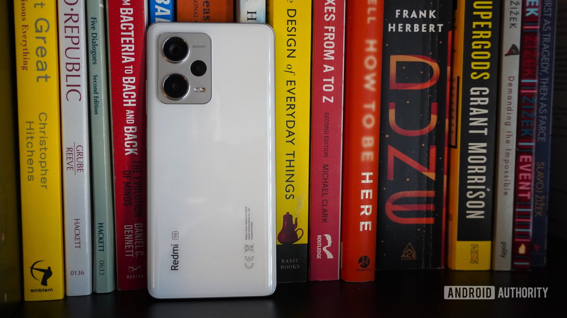 Redmi Note 12 Pro Plus standing on bookshelf