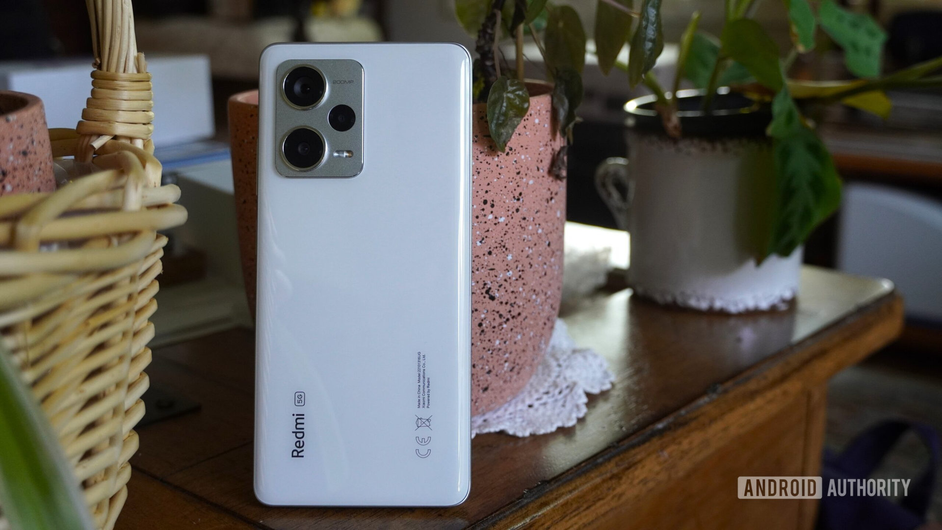 Redmi Note 12 Pro Plus standing with plants