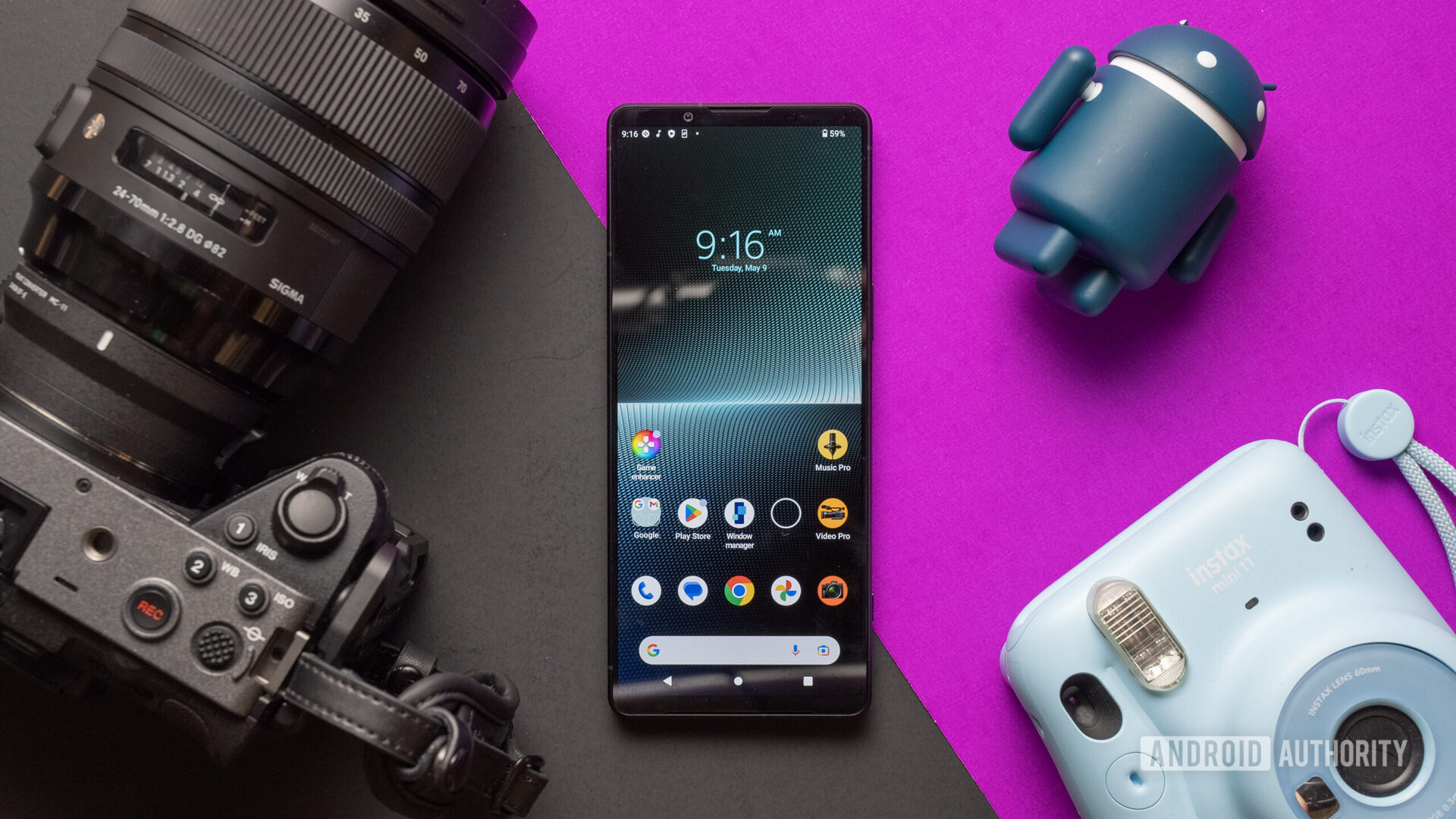 Sony Xperia 1 V front with props black magenta background