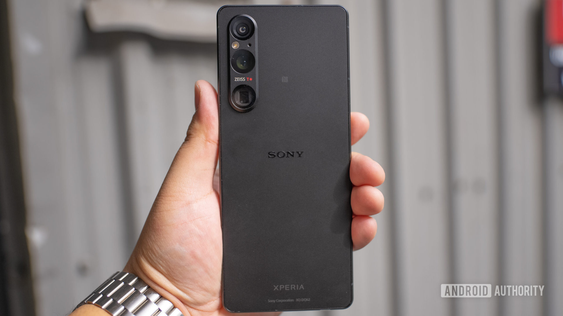 Sony Xperia 1 V in hand outside metal background