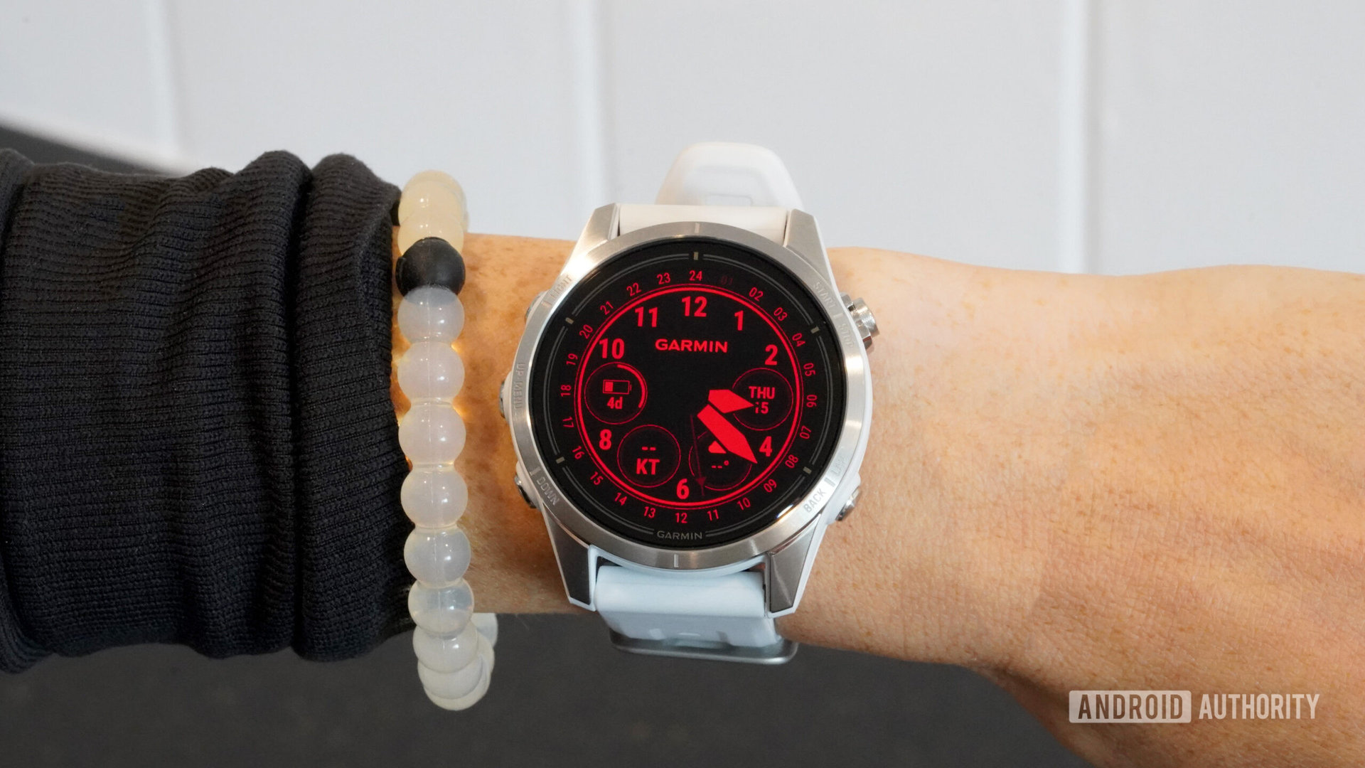 A watch face in red shift mode utilizes only red hues.