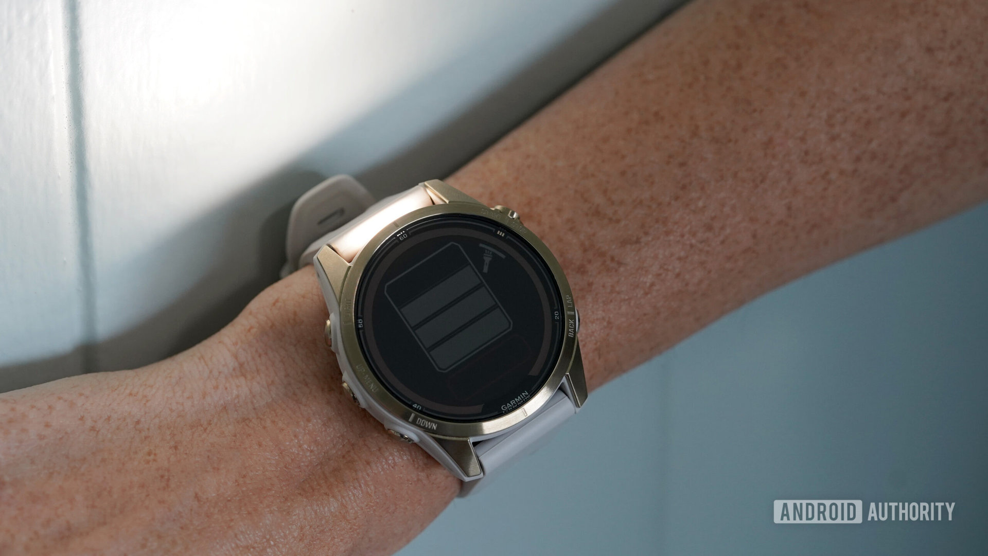 A Garmin fenix 7 Pro on a user's wrist demonstrates the brightest modes of its LED flashlight.
