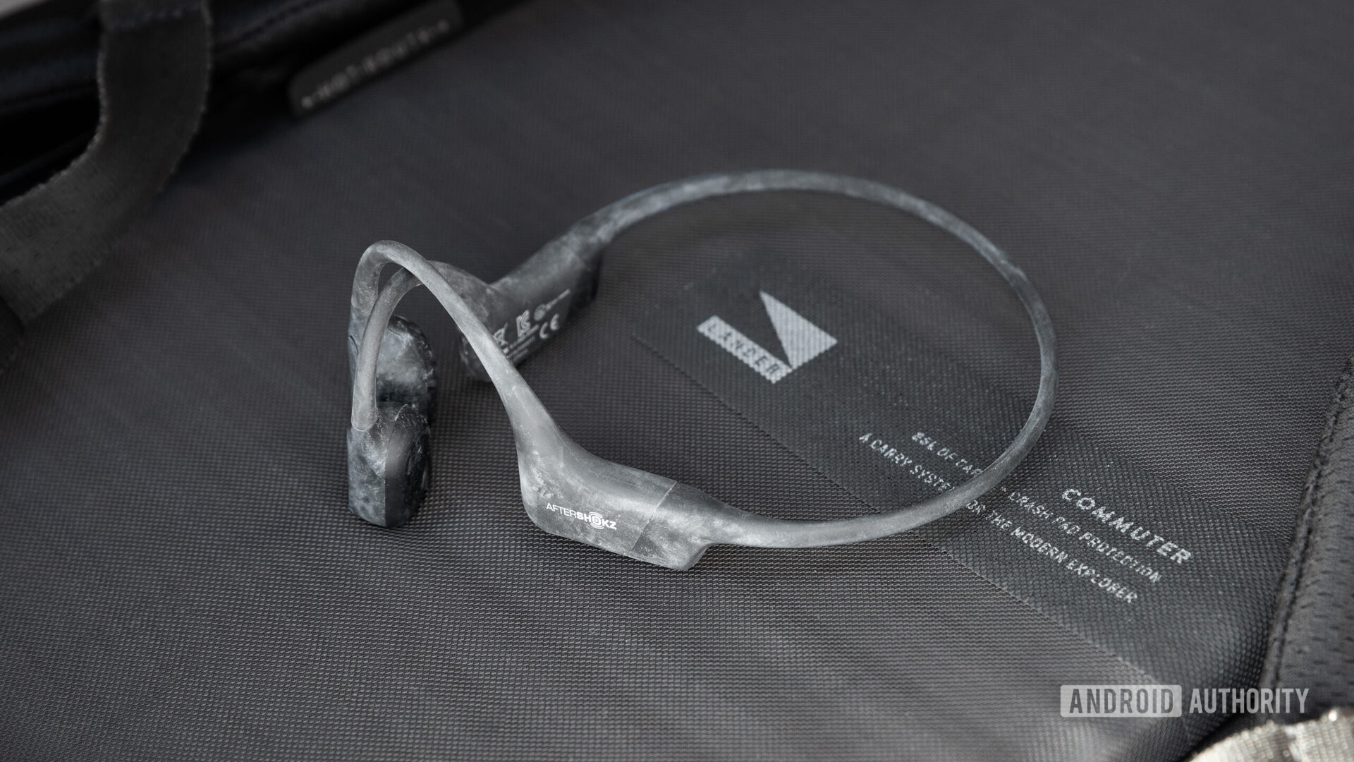 The Aftershokz Aeropex in black with chalk on them.
