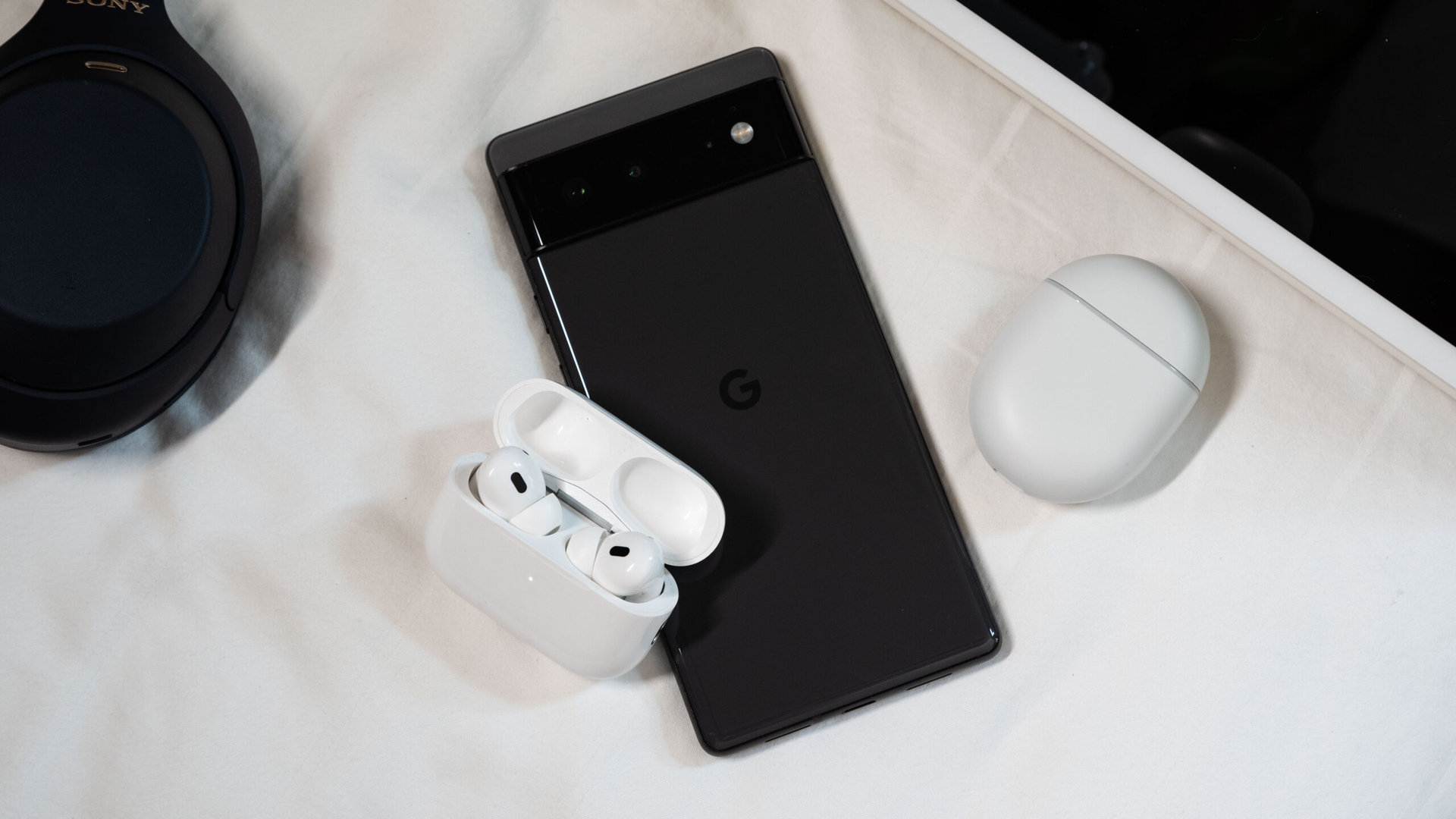 The AirPods Pro 2nd generation on top of a Google Pixel 6.