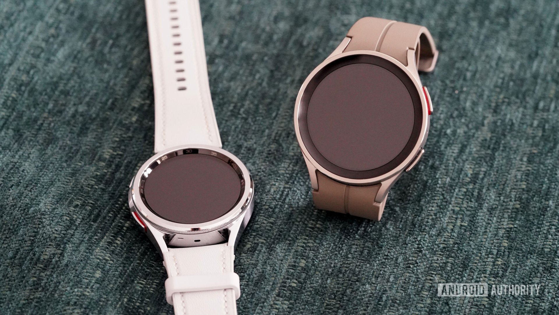 A Galaxy Watch 5 Pro and 6 Classic rest on a green surface.