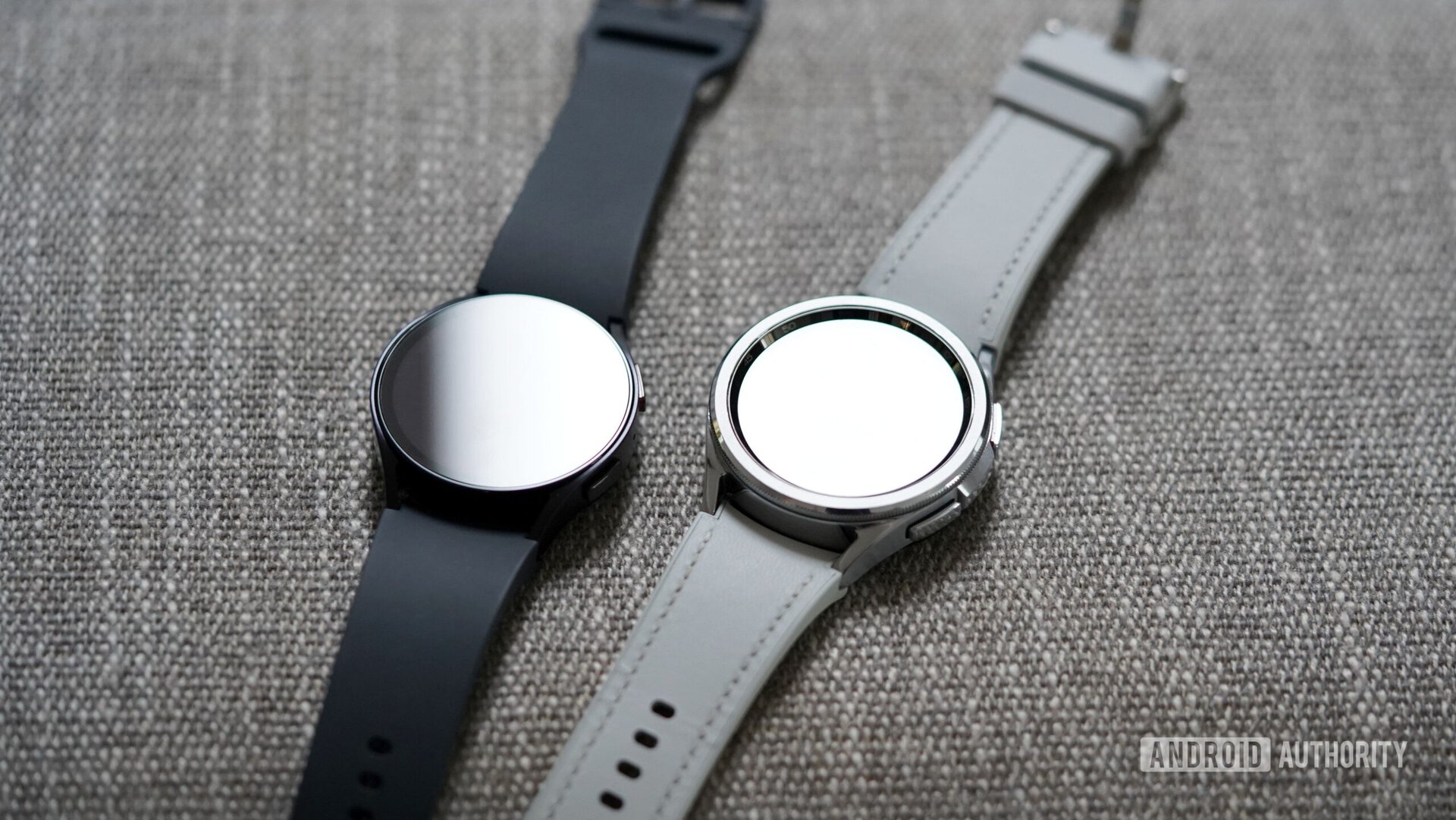 Samsung Galaxy Watch 6 series devices rest on a gray surface.