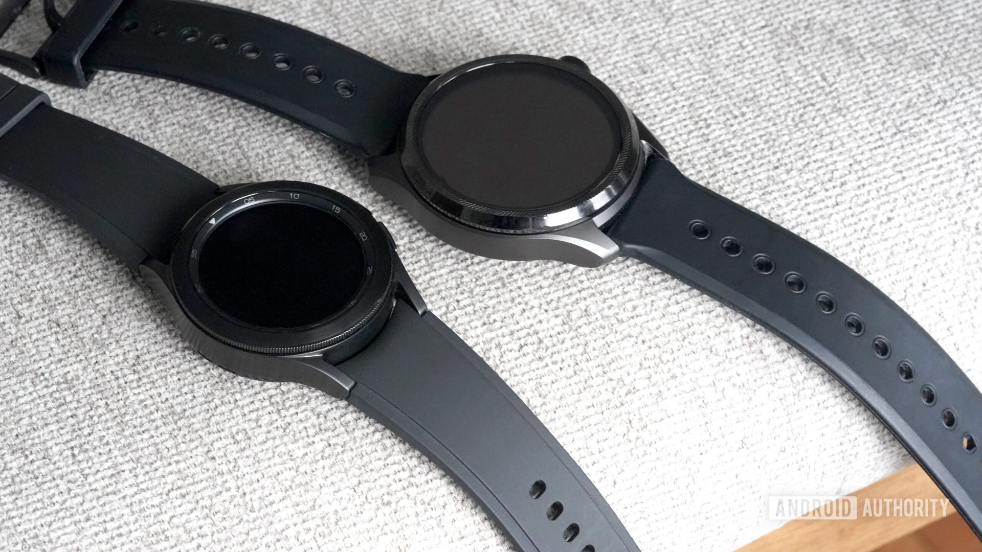 A Samsung Galaxy Watch 4 rests alongside a Mobvoi TicWatch 5, both representing devices with a bezel.