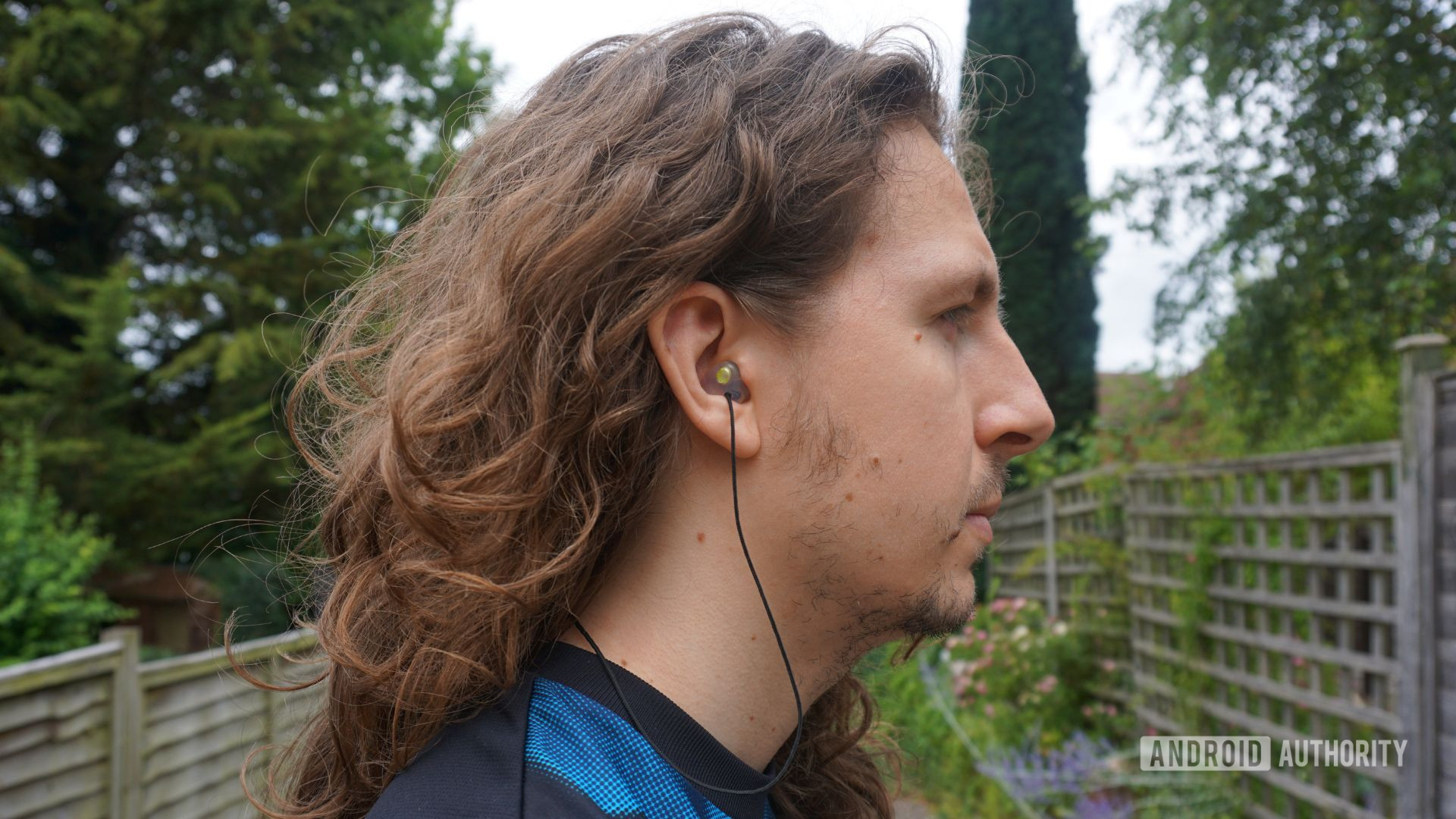 acs custom earplug with removable neckband being worn