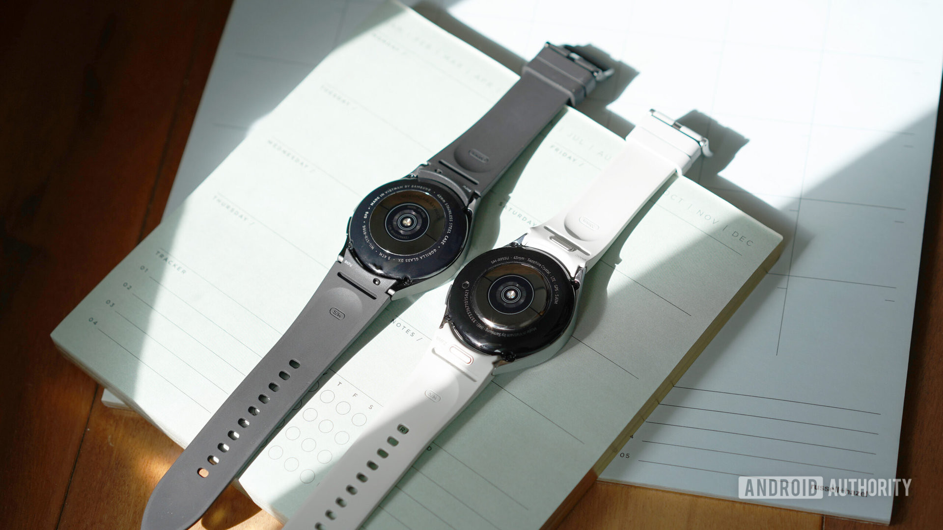 A Samsung Galaxy Watch 6 Classic and 4 Classic rest side by side displaying their sensors.