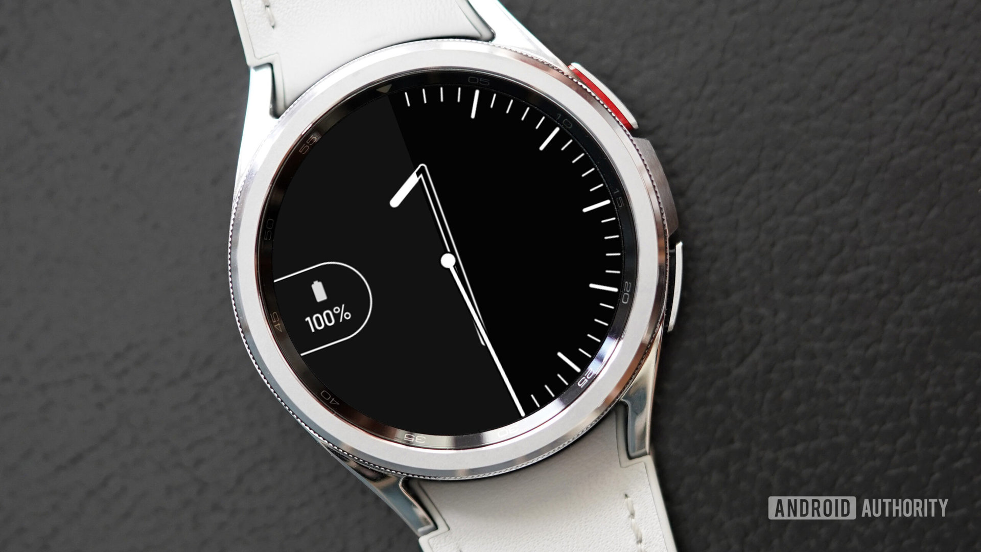 A Galaxy Watch 6 Classic displays the watch face Vanishing Number.