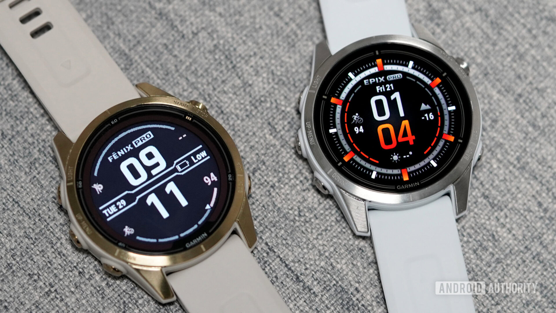 A Garmin Epix Pro and Fenix 7 rest side by side displaying their watch faces.