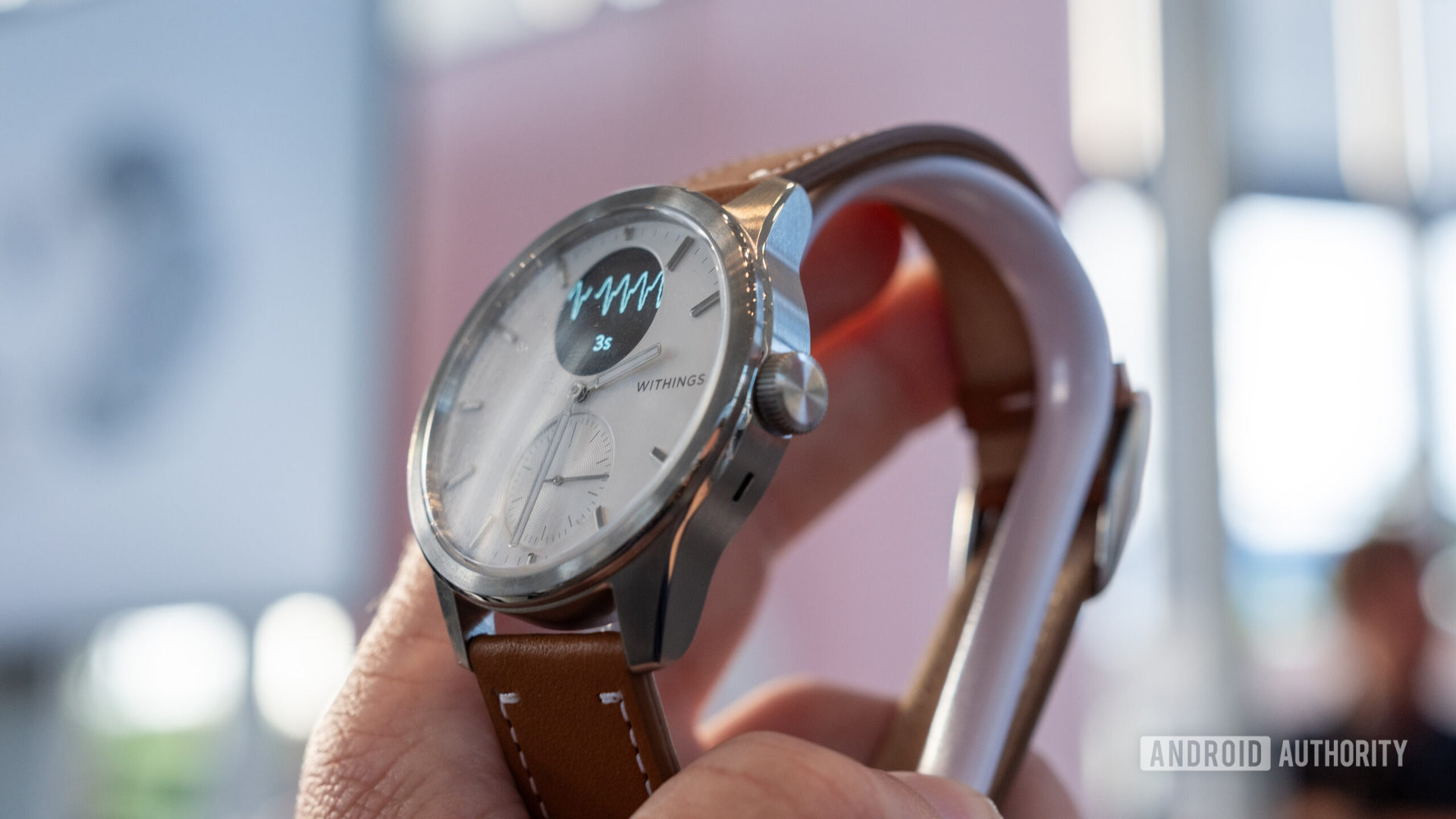Withings Scanwatch 2 with brown leather strap from side angle showing crown