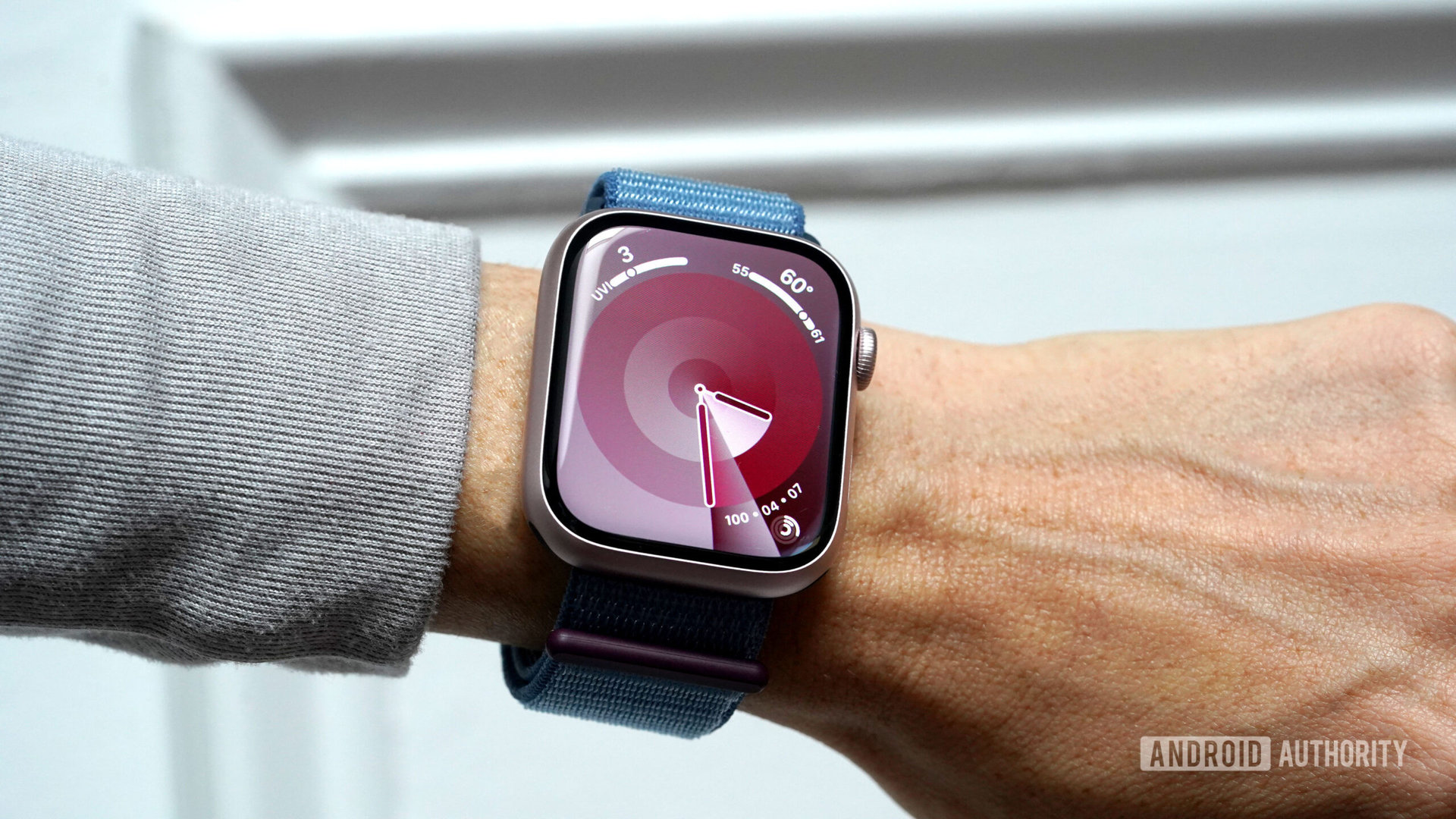 An Apple Watch Series 9 displays the Palette watch face.
