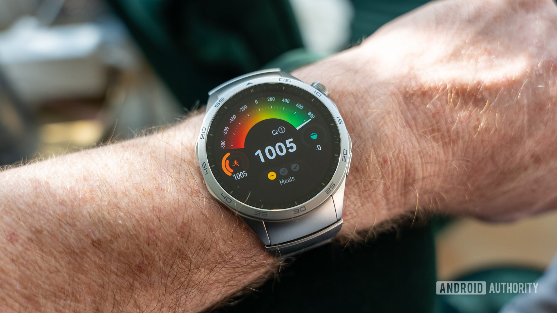 Huawei Watch GT 4 smartwatch on wrist showing calorie counter