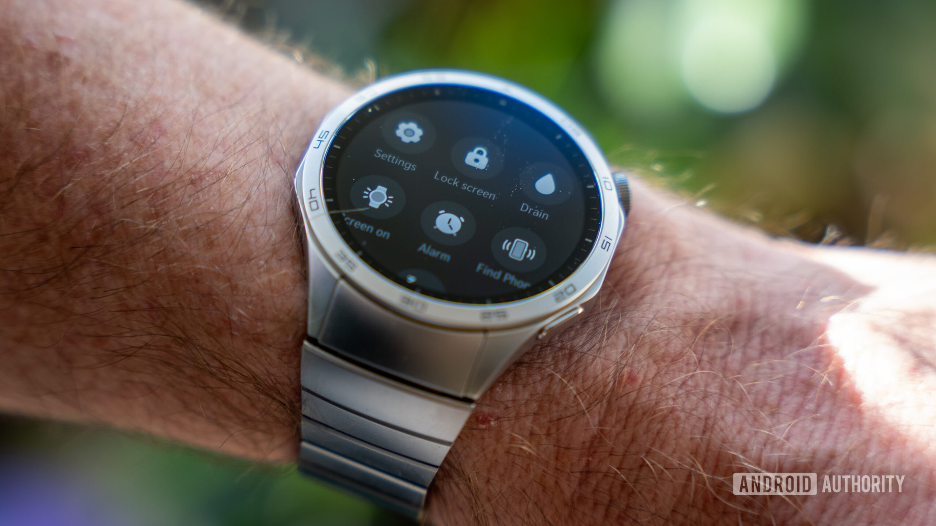 Huawei Watch GT 4 smartwatch on wrist showing quick settings toggles