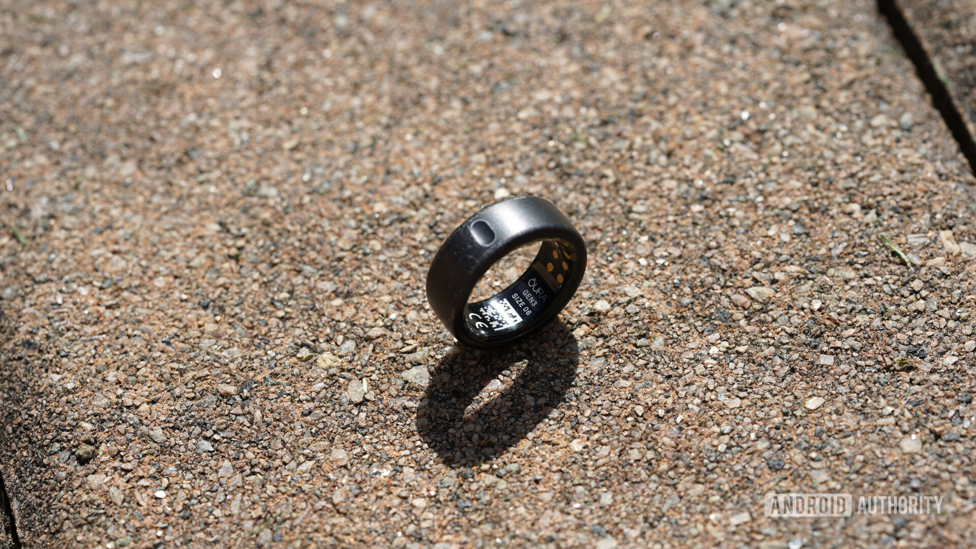 An Oura Ring rests on a stone surface, displaying its Gen 3 label.
