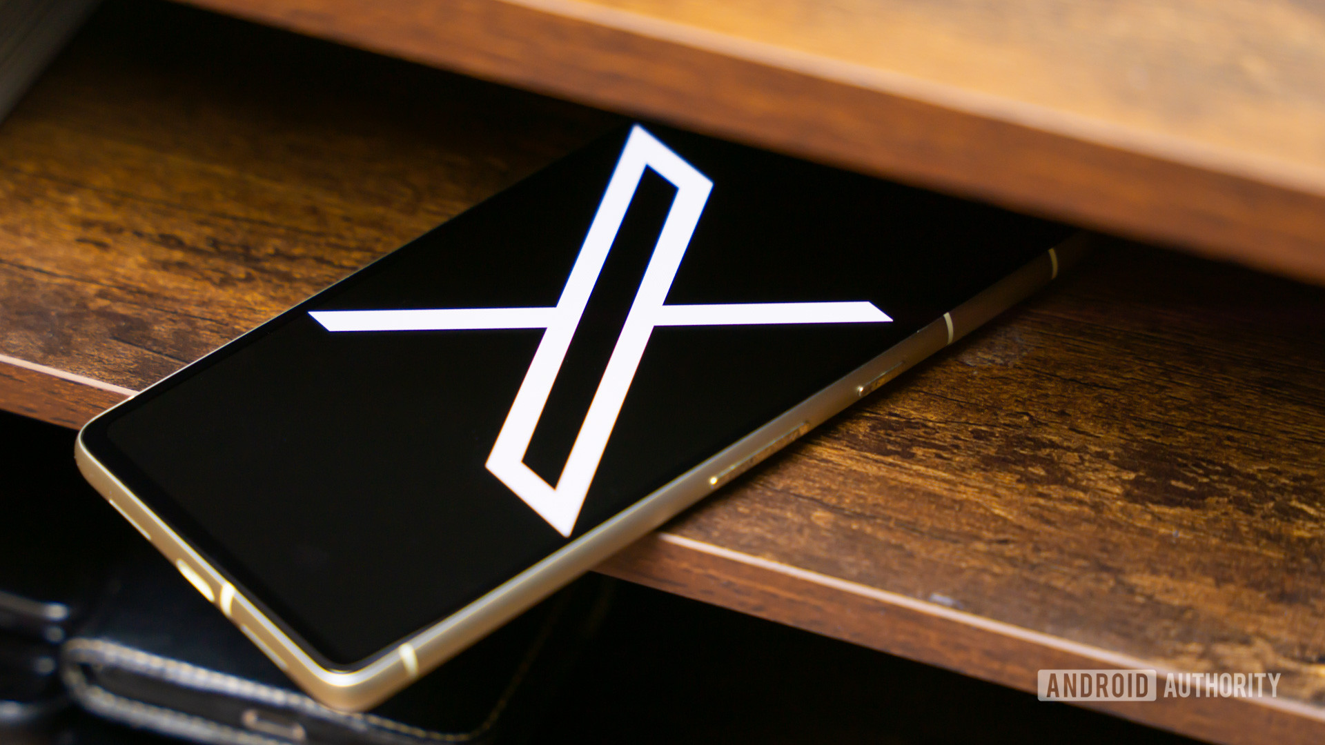 X logo on smartphone stock photo (aka Twitter) (2)