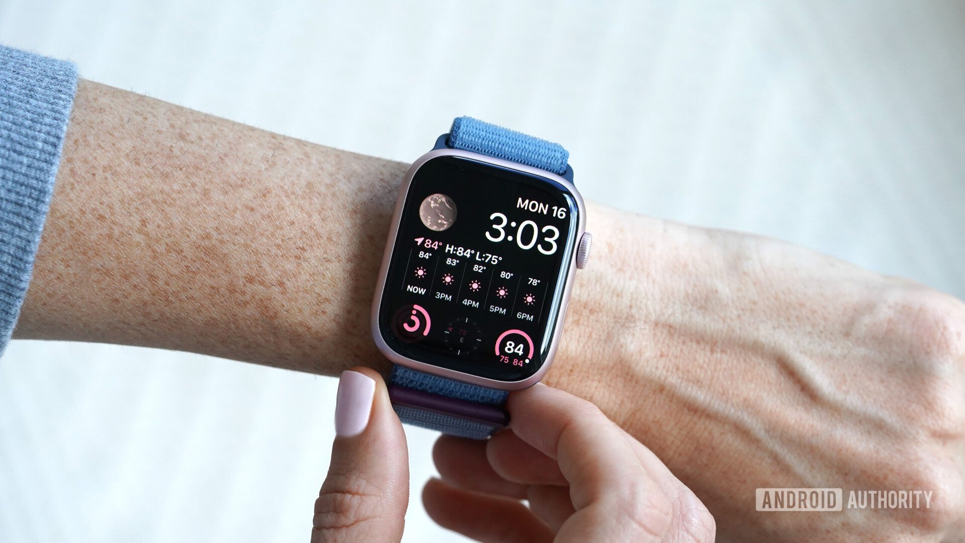 An Apple Watch Series 9 displays the Modular watch face.