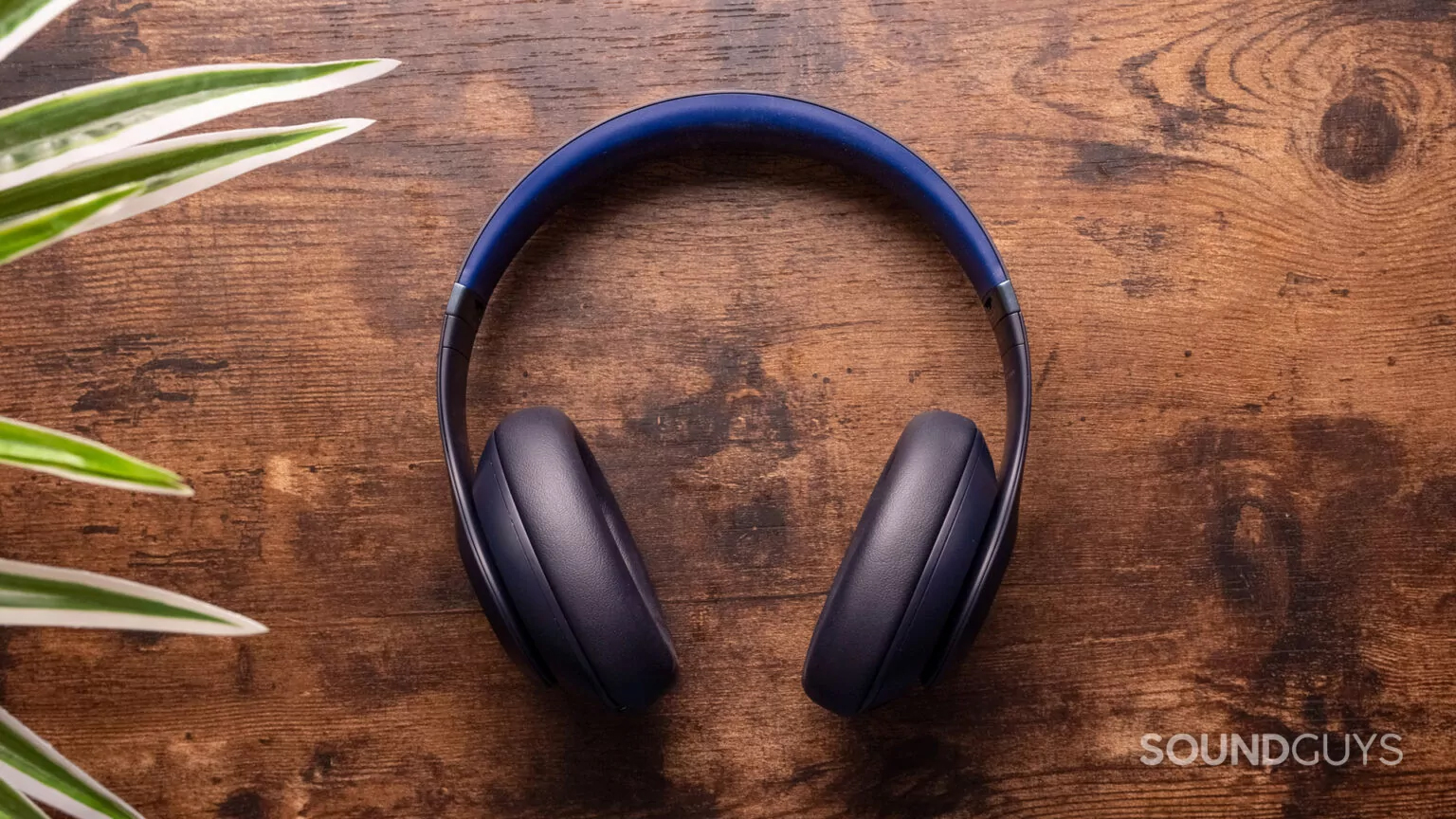 Beats Studio Pro headphones on wood table