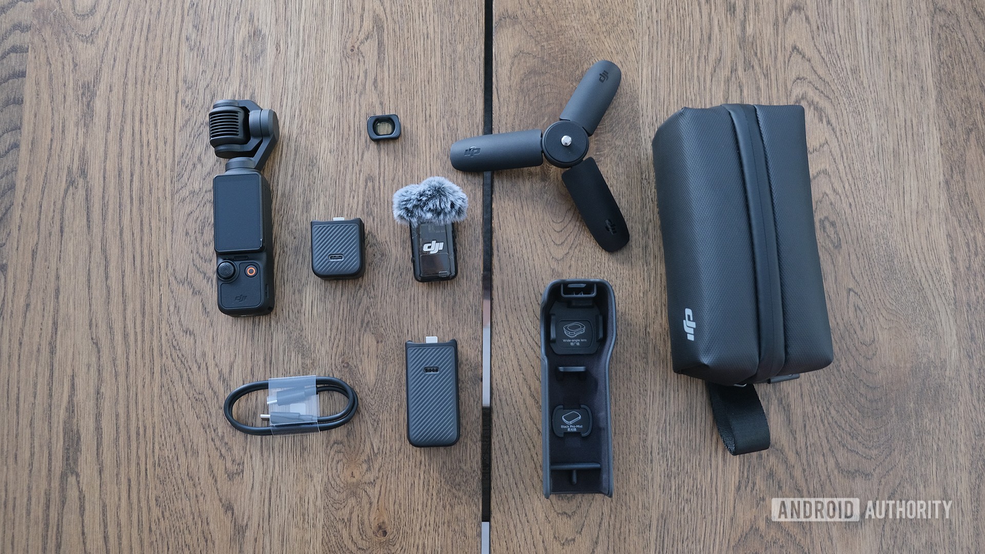 DJI Osmo Pocket 3 with contents of Creator Combo package displayed on a table