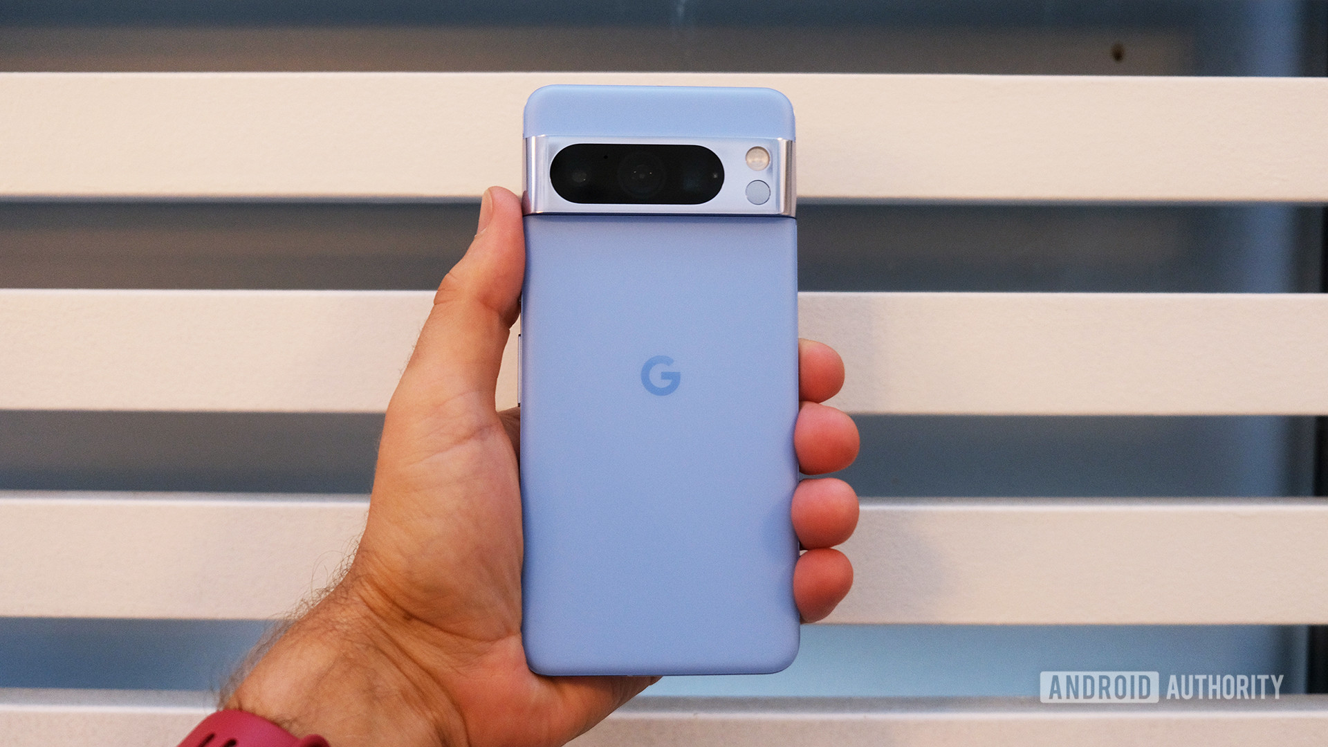 Google Pixel 8 Pro in Bay blue color held in hand