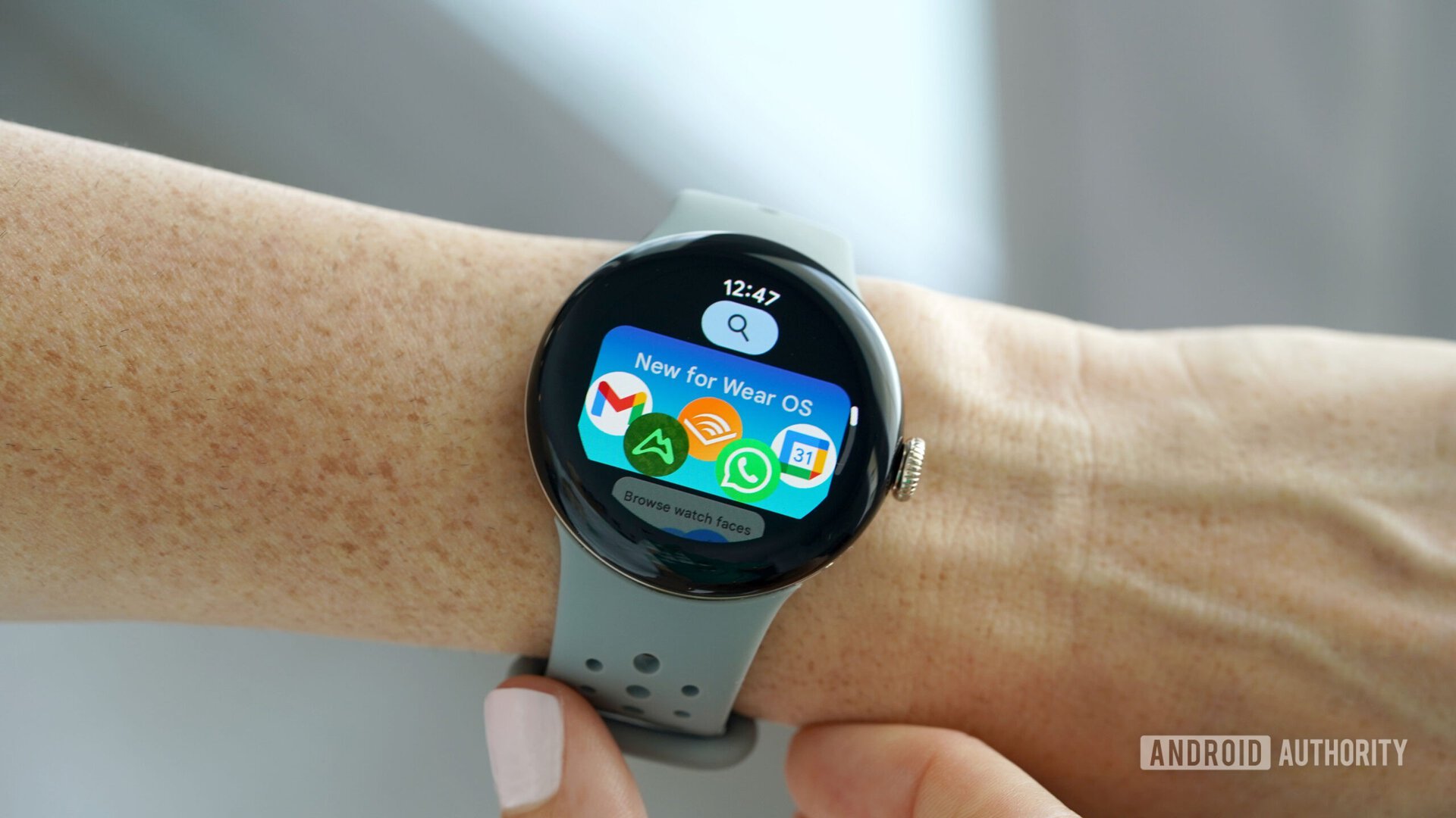A Google Pixel Watch 2 displays the Google Play Store.