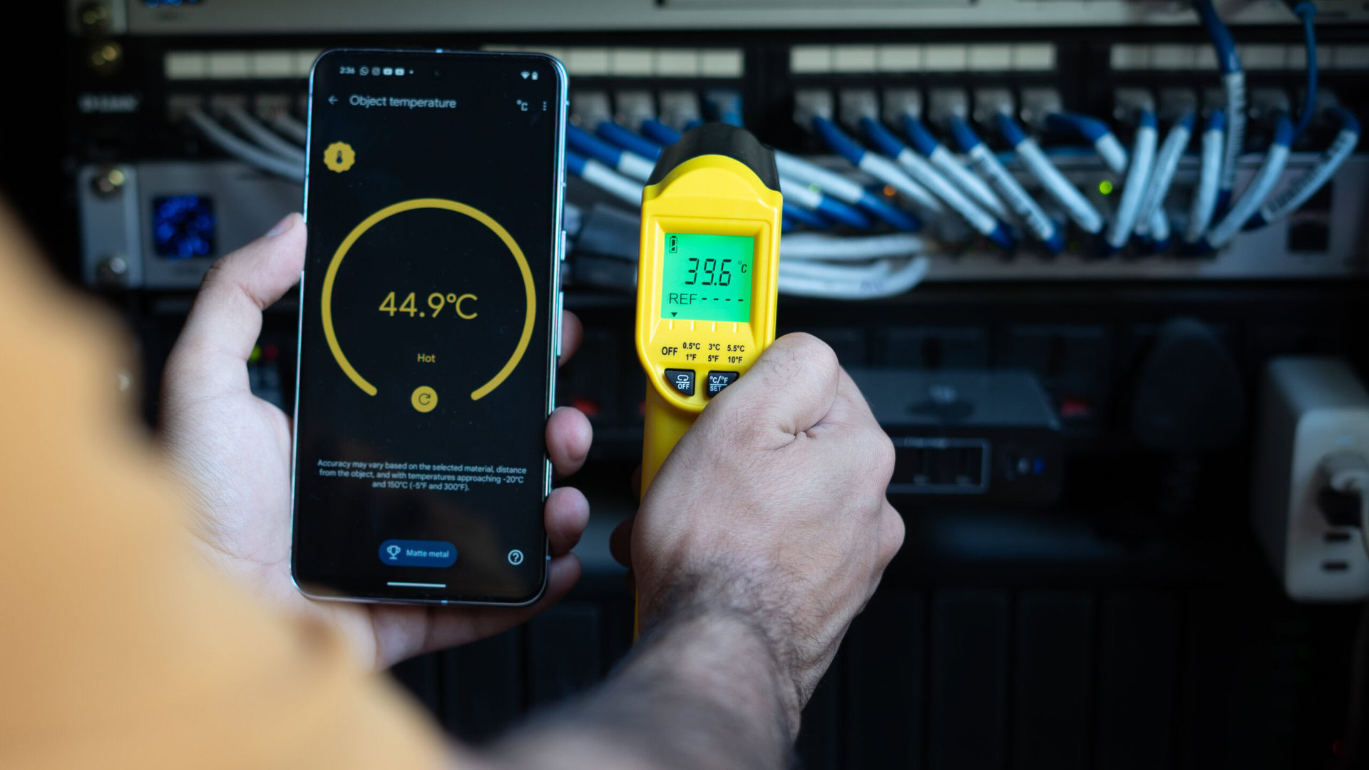 Pixel 8 Pro vs Stanley IR Thermometer measuring network rack temperature