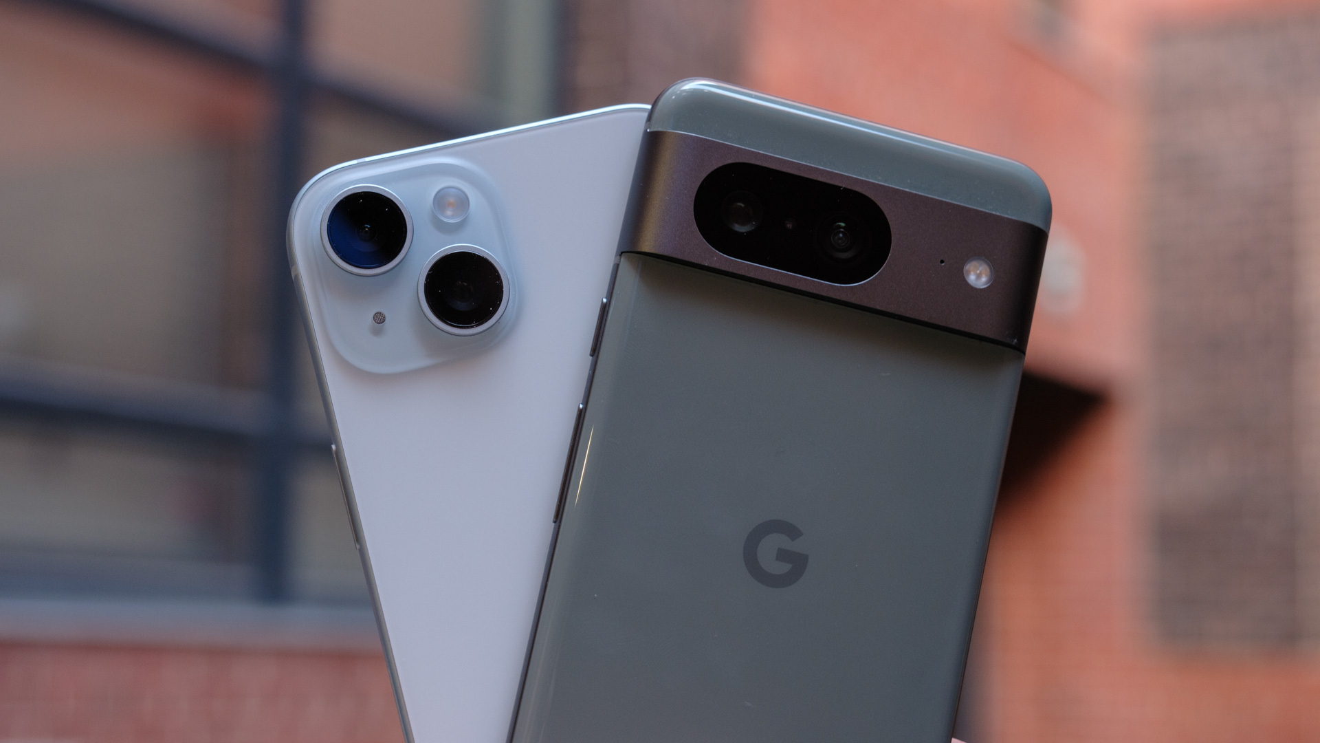 google pixel 8 vs iphone 15 cameras in hand