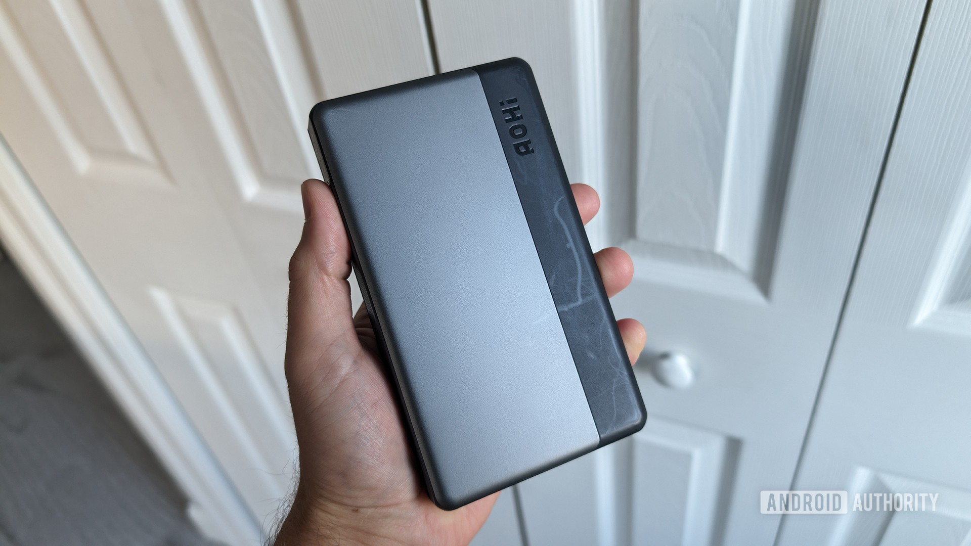 AOHI Laptop Power Bank 100W in hand