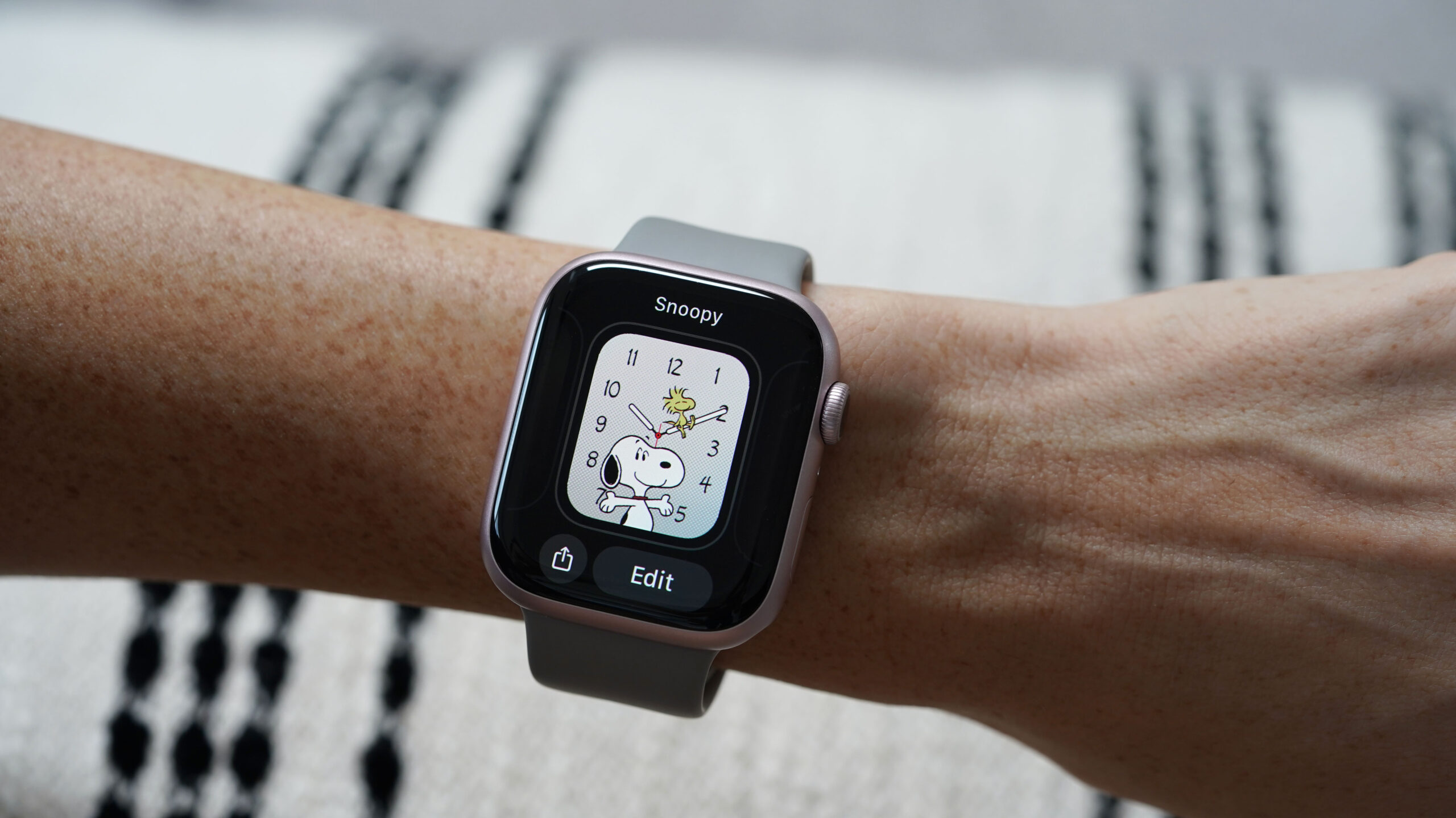 An Apple Watch Series 9 user edits the Snoopy watch face.