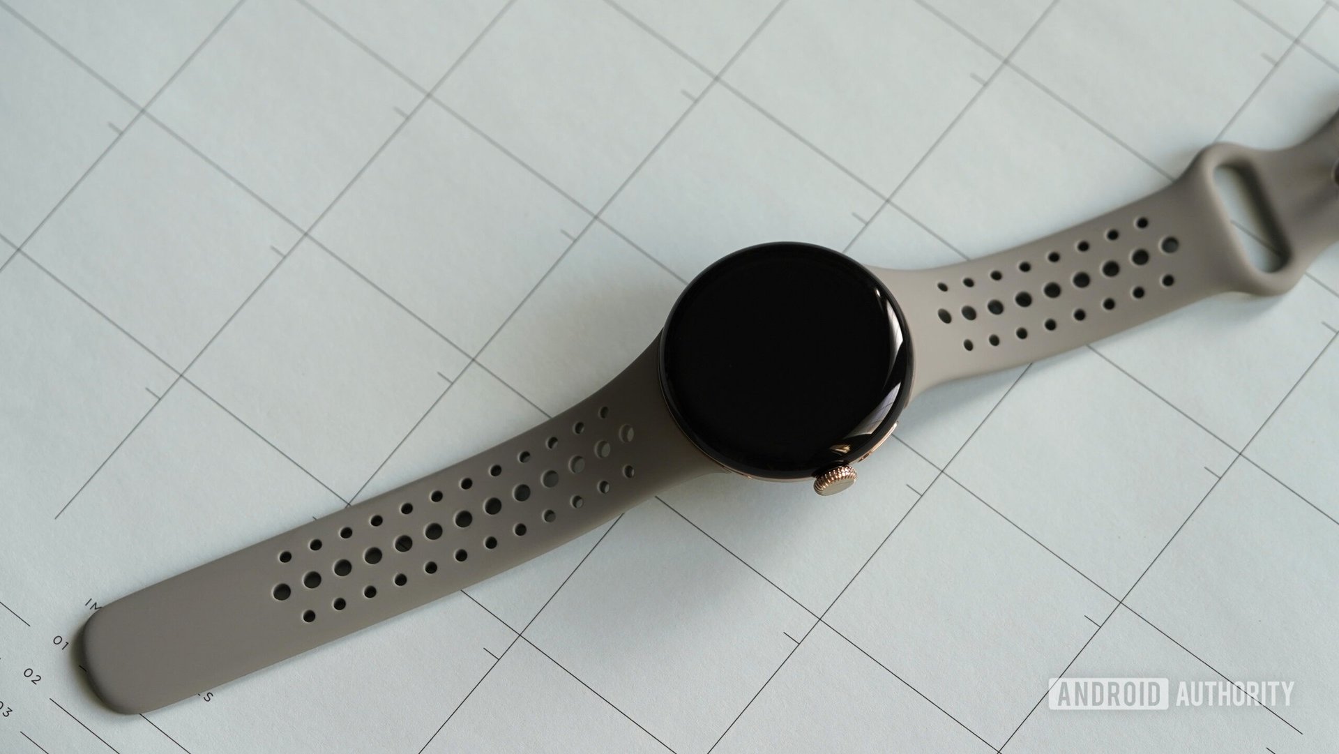 A Google Pixel Watch 2 rests on a calendar.