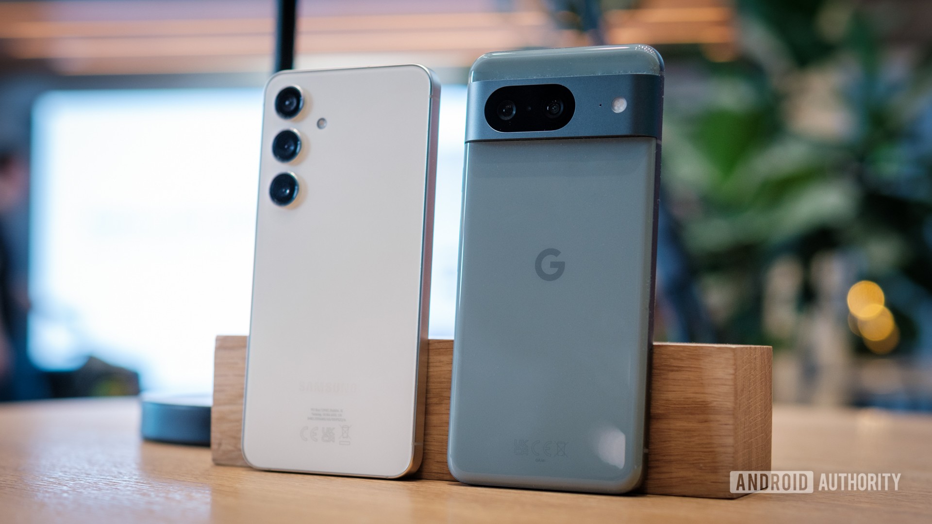 Samsung Galaxy S24 vs Google Pixel 8 backs standing at angle