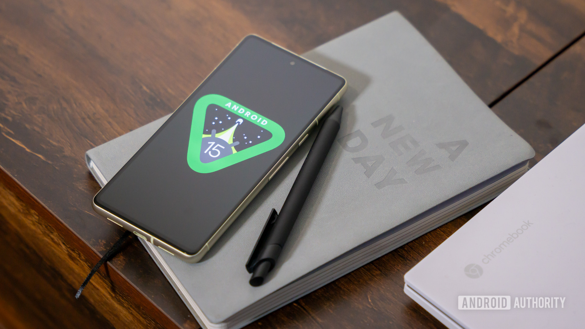 Android 15 logo on smartphone on table stock photo (19)