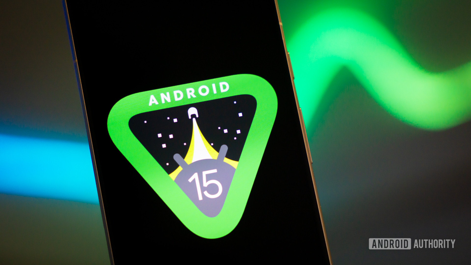 Android 15 logo on smartphone with light strip in background stock photo (16)