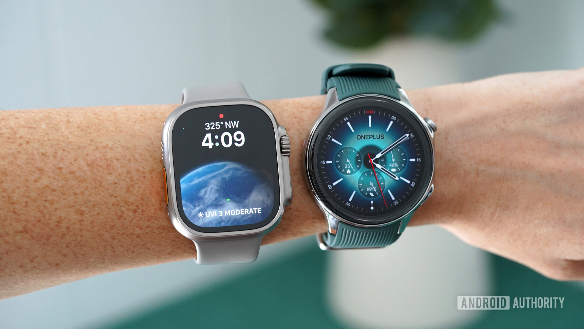 A user wears a OnePlus Watch 2 and Apple Watch Ultra 2 on their wrist.