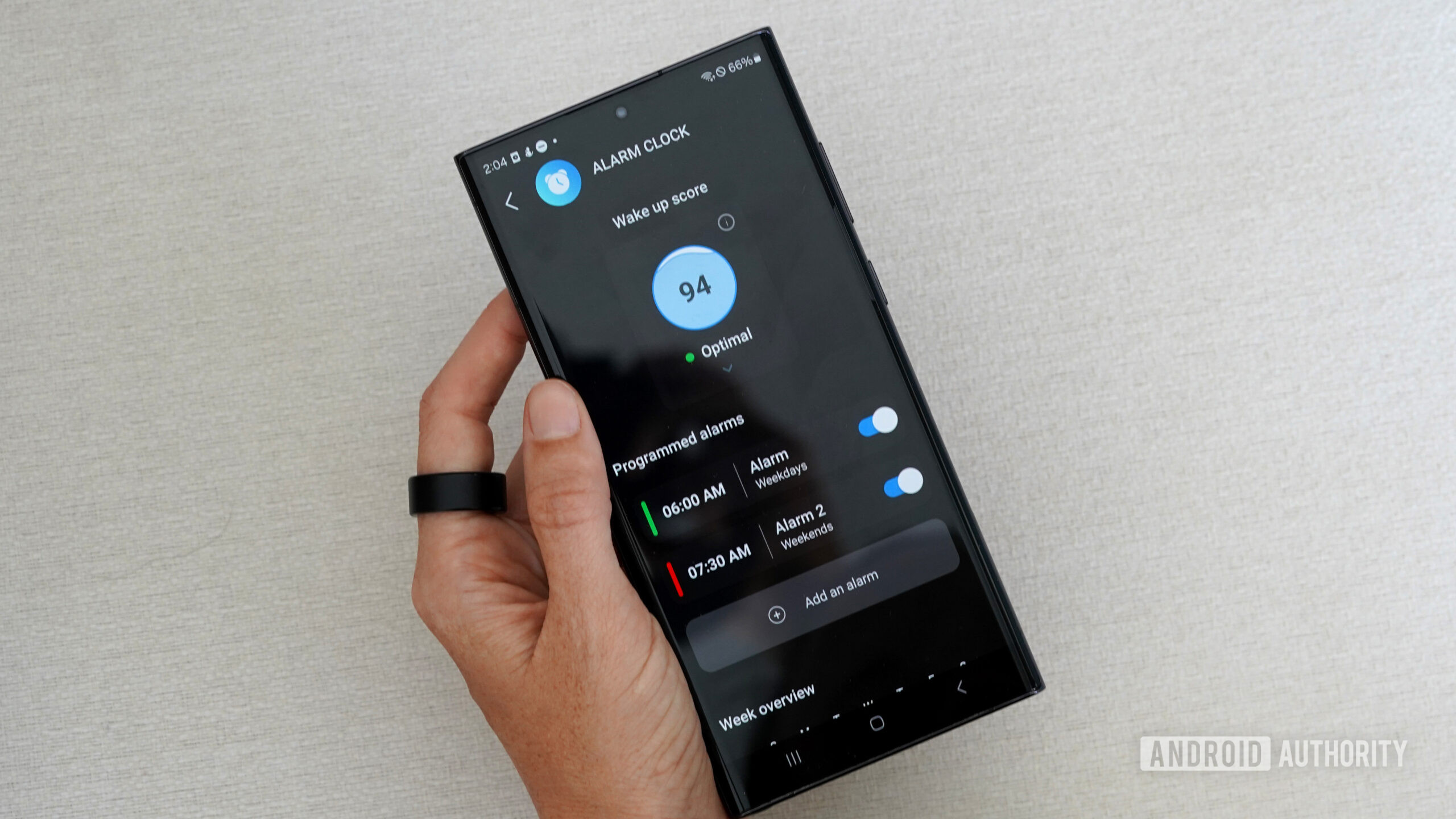 A Circular Ring Slim user sets an alarm schedule in the companion app.