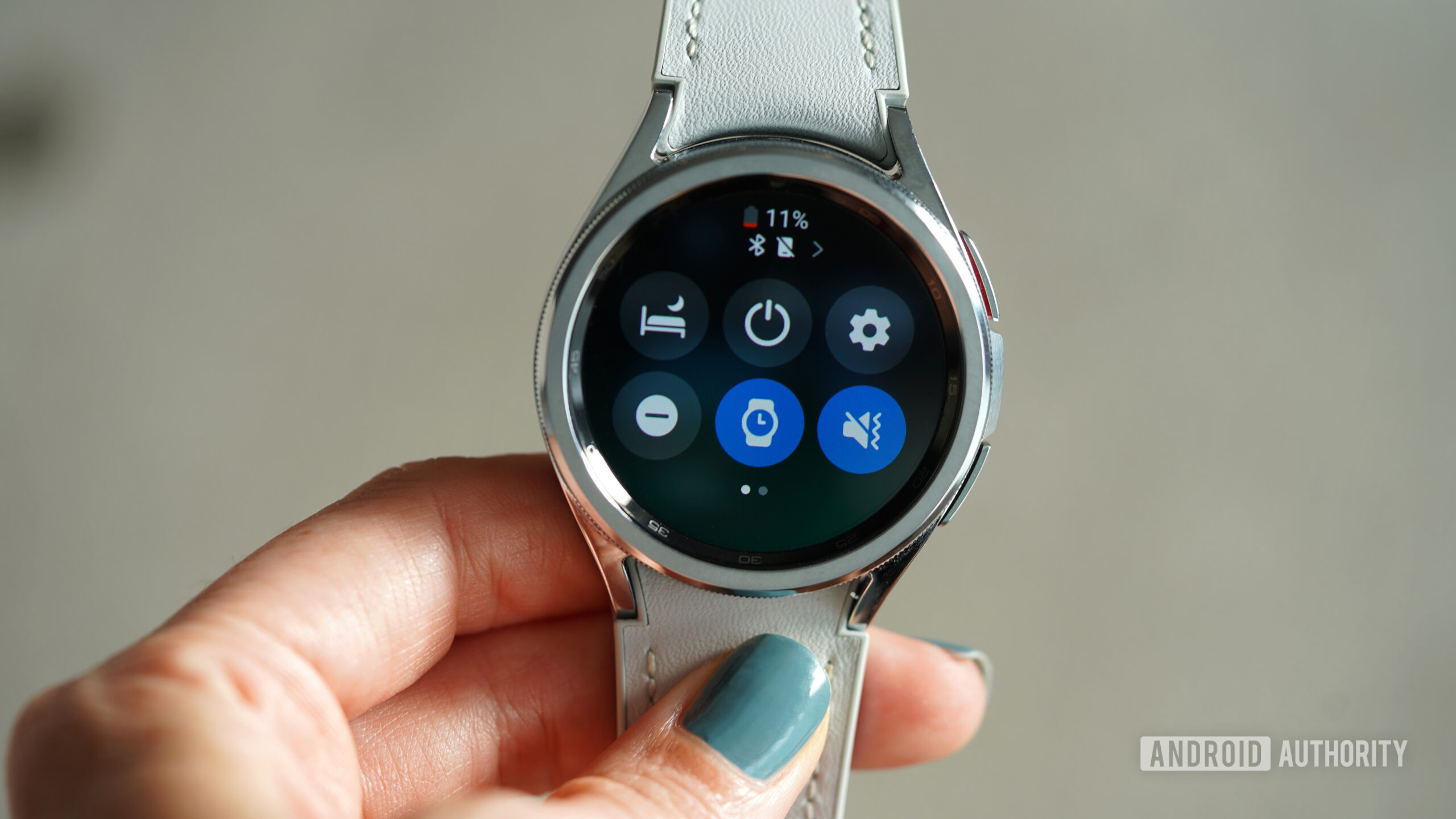 A user accesses the quick settings panel on their Samsung Galaxy Watch 6.